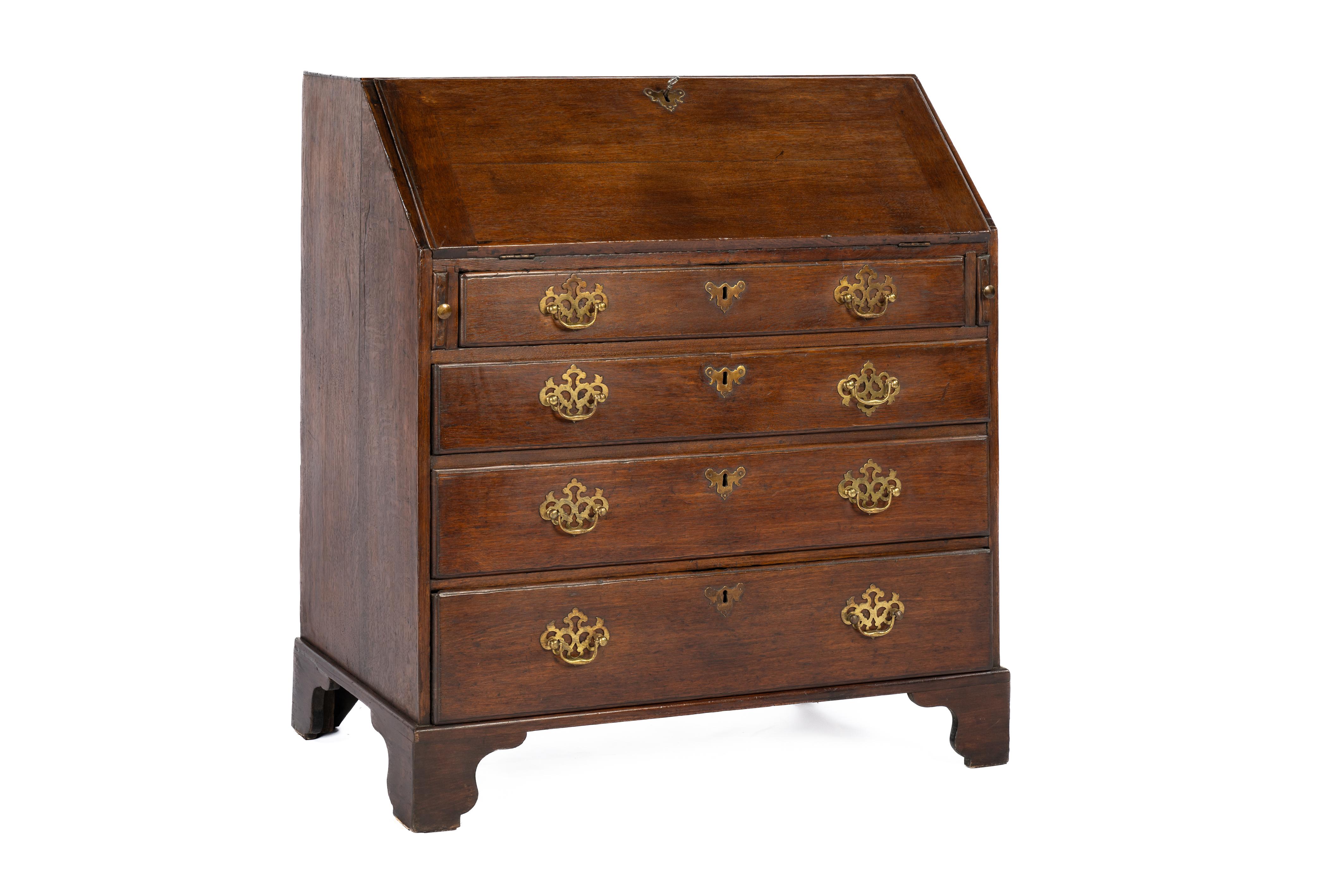 On offer here is a beautiful Queen Anne slant front desk was made in England in the late 18th century. It was completely made in the finest quality European oak, including the drawers interiors. It stands on bracket feet with four drawers fitted
