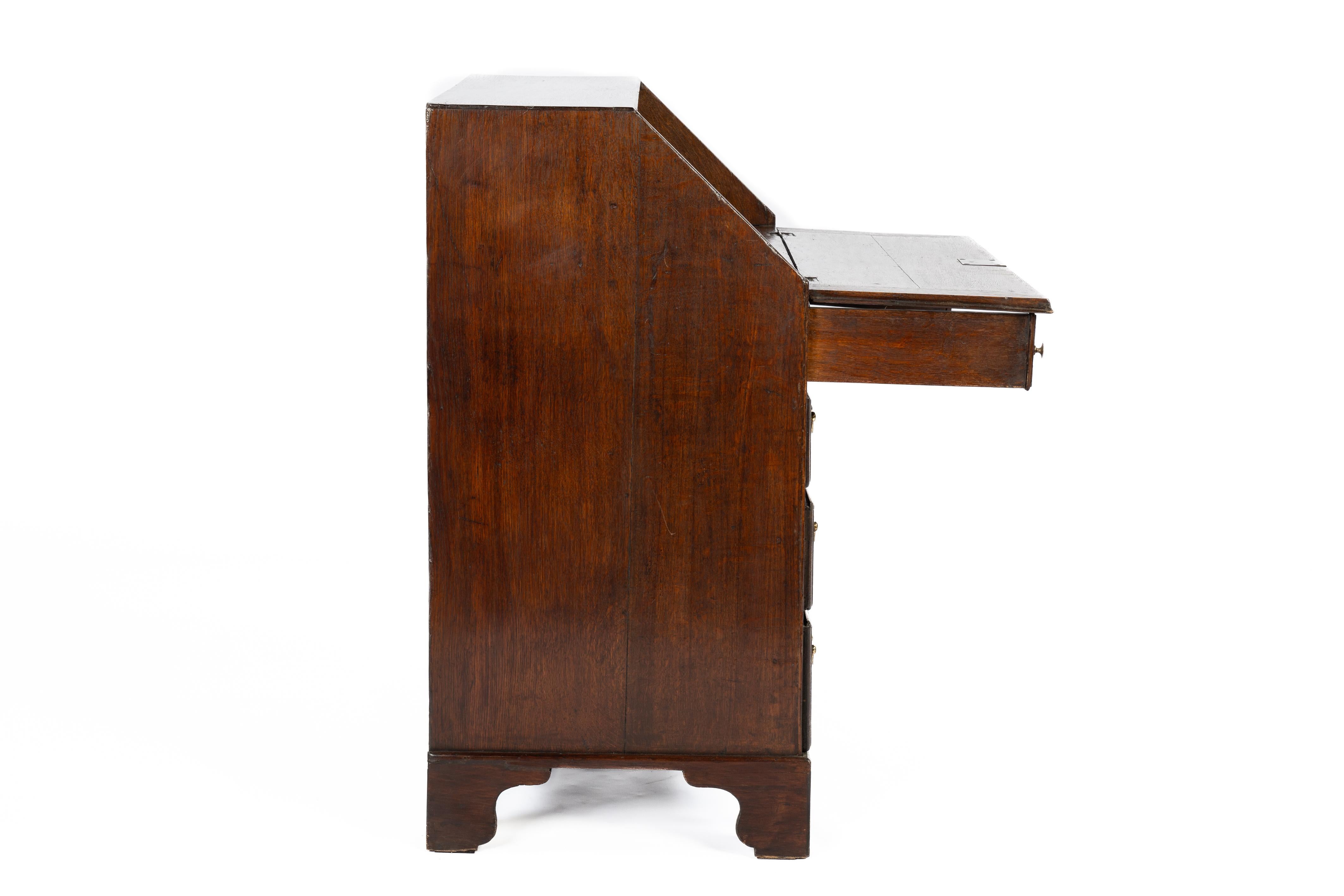18th Century Antique 18th century warm brown English Oak Queen Anne Slant-Front Desk For Sale