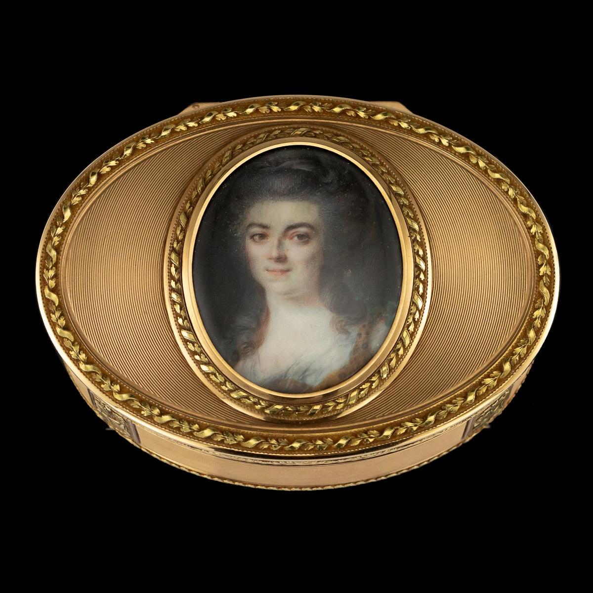 Antique late-18th century German magnificent 18-karat gold snuff box, large and of oval form, within a laurel and ribbon frame on a linear engine-turned ground with laurel and ribbon border, the sides decorated with festoons and bead band on sable