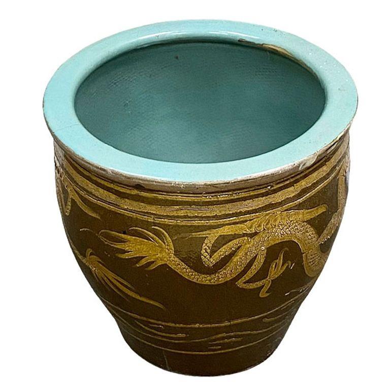 Late 19th Century Century egg Chinese art pottery pot featuring an Asian dragon along the front. These Pots are over 120 years old and were used to store black 