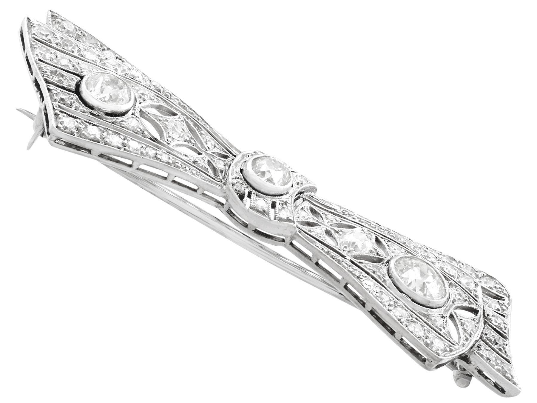 Old European Cut Antique 1900s 2.55 Carat Diamond White Gold Bow Brooch For Sale