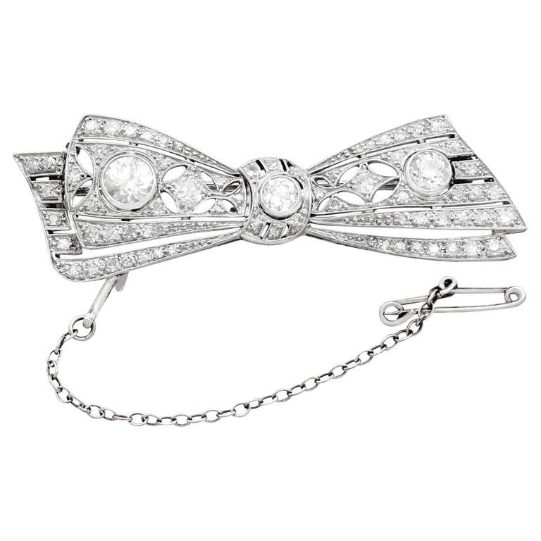 Antique 1900s 2.55 Carat Diamond White Gold Bow Brooch For Sale