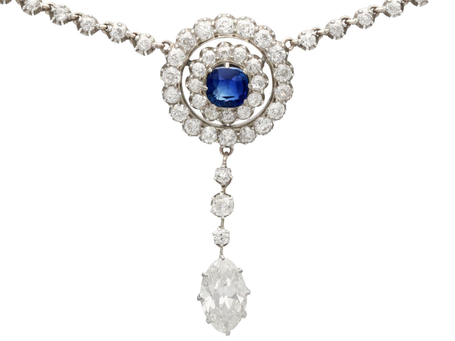 A stunning antique 3.69 carat diamond and 0.65 carat sapphire, 10 karat yellow gold and silver set necklace with a platinum chain; part of our diverse antique jewelry collections.

This stunning, fine and impressive antique sapphire and diamond