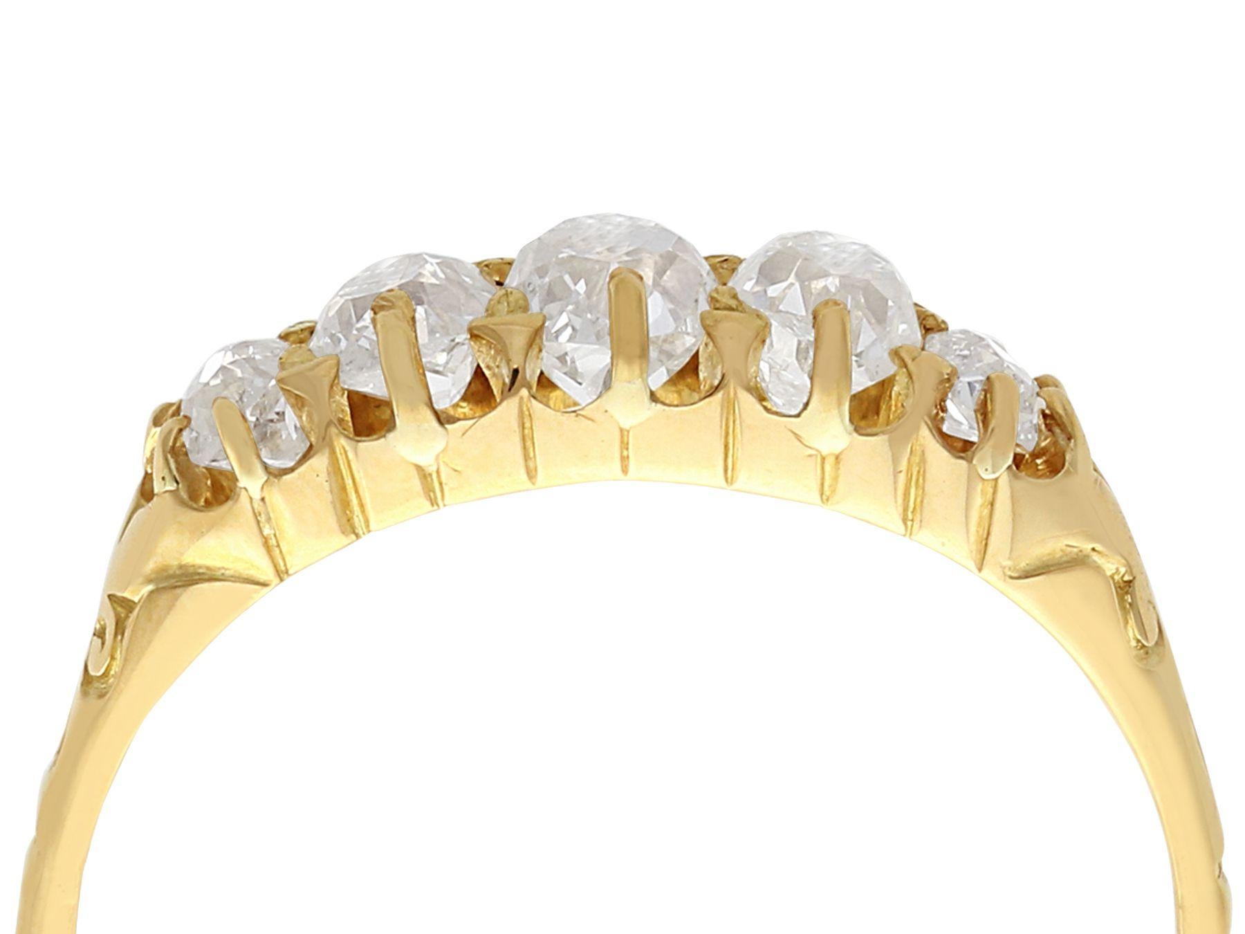 A fine and impressive antique 0.88 carat diamond and 18 karat yellow gold five stone ring; part of our antique jewelry and estate jewelry collections

This impressive antique five stone ring has been crafted in 18k yellow gold.

The elevated plain