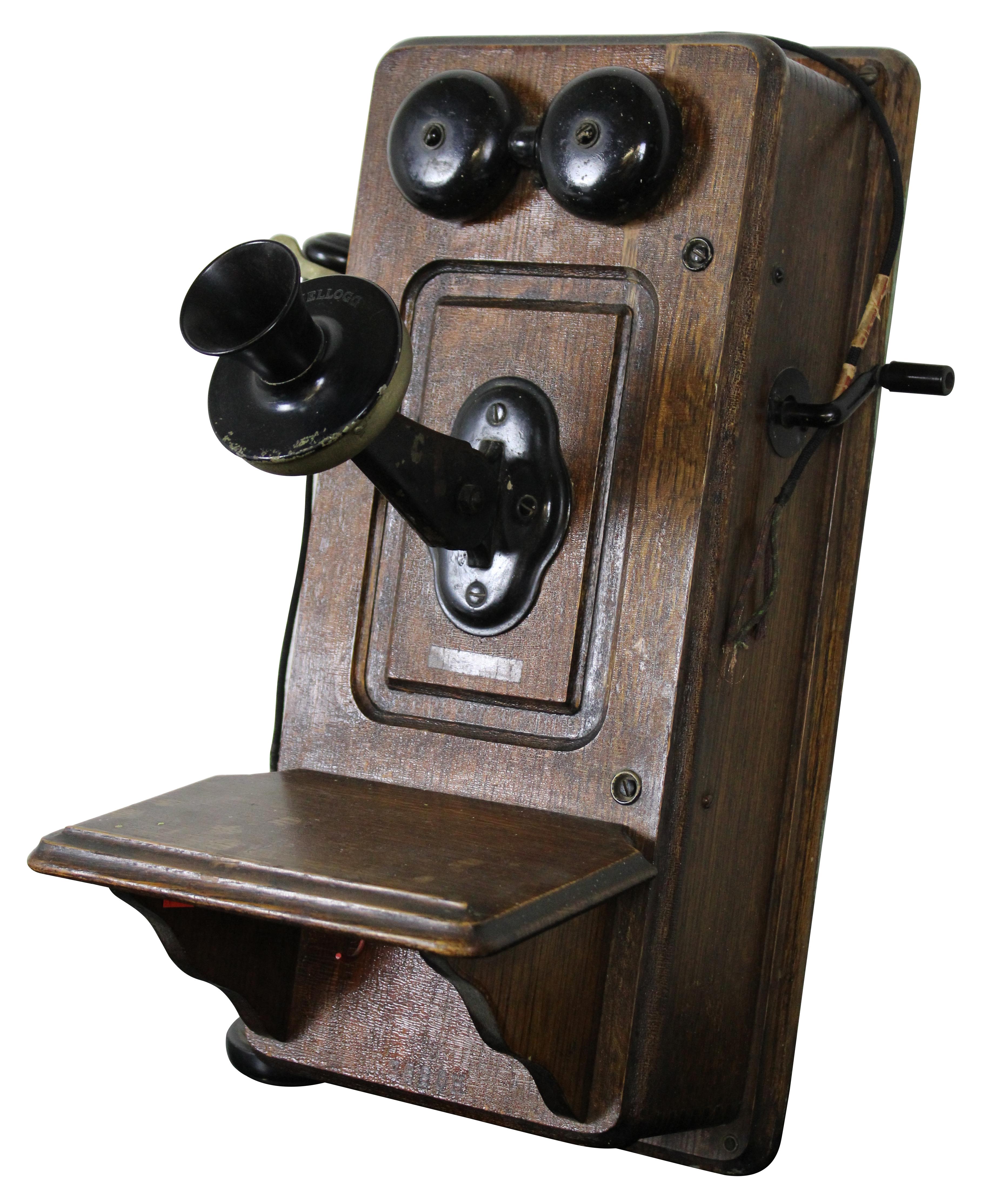 Antique early 1900s quartersawn tiger oak wall mounted telephone by the Kellogg Switchboard and Supply Company.
 