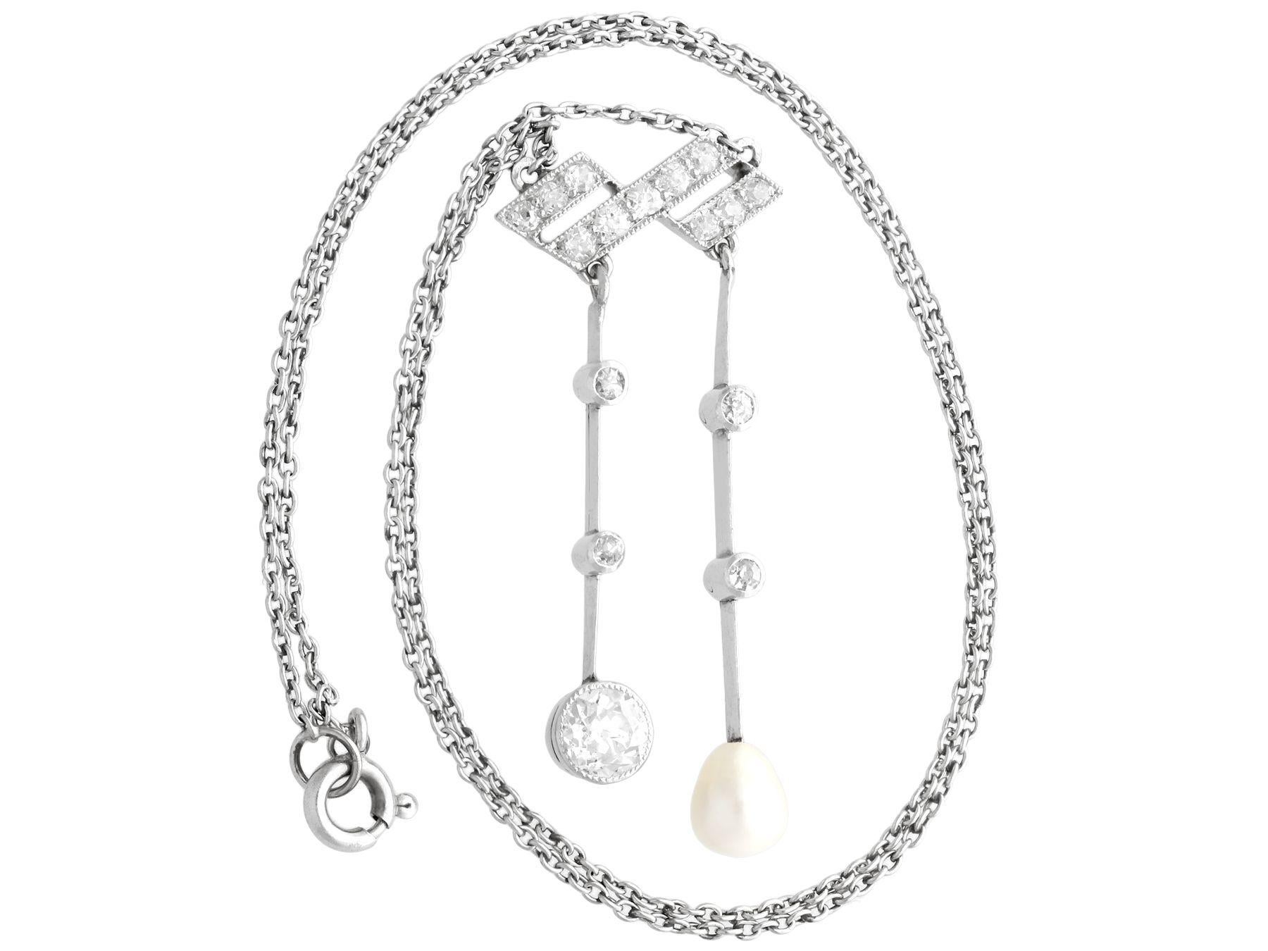 A fine and impressive antique pearl, 1.12 carat diamond and platinum drop necklace; part of our diverse antique jewelry and estate jewelry collections.

This fine and impressive pearl and diamond drop necklace has been crafted in platinum.

The