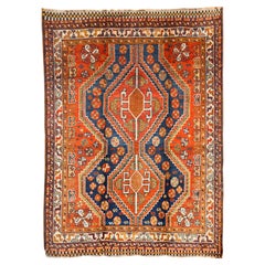 Antiker persischer Qashqai-Teppich aus Wolle, rot, blau, grün, marineblau, 5' x 7', 1900er Jahre