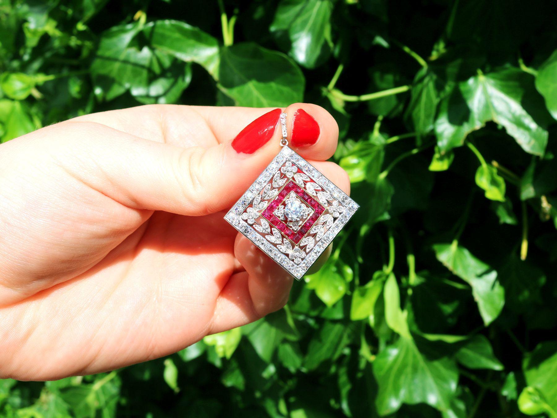 A magnificent and exceptional antique 3.48 carat diamond and 0.53 carat ruby, platinum and 18 karat yellow gold pendant / brooch; part of our diverse antique jewelry collections.

This magnificent, fine and impressive ruby and diamond pendant/brooch