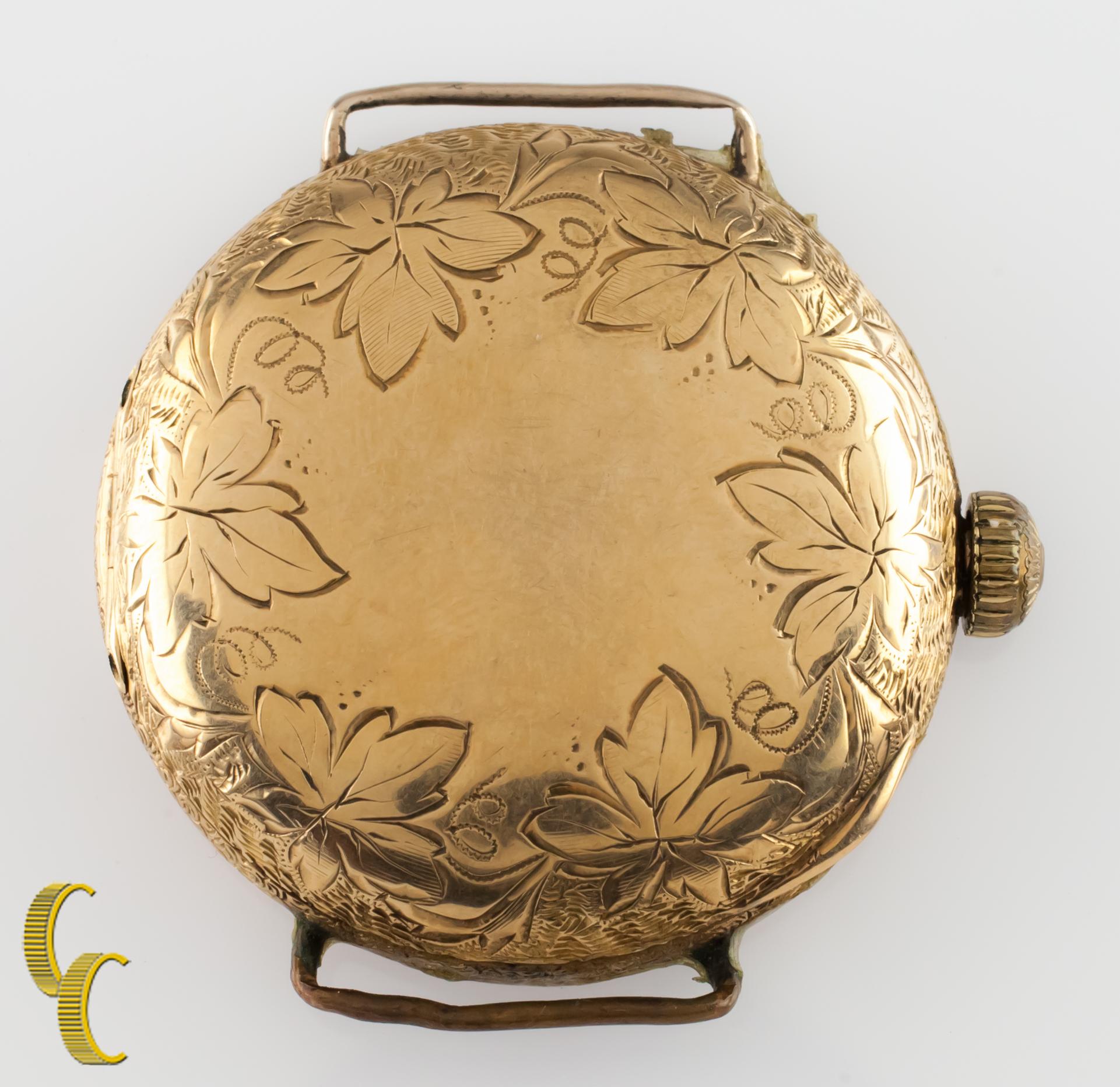 Beautiful antique Waltham pocket watch with white dial, featuring black hands and a dedicated seconds dial.
14k yellow gold case with intricate hand-etched design on case.
Can be used as pocket watch or wrist watch. (Requires a watch strap to be