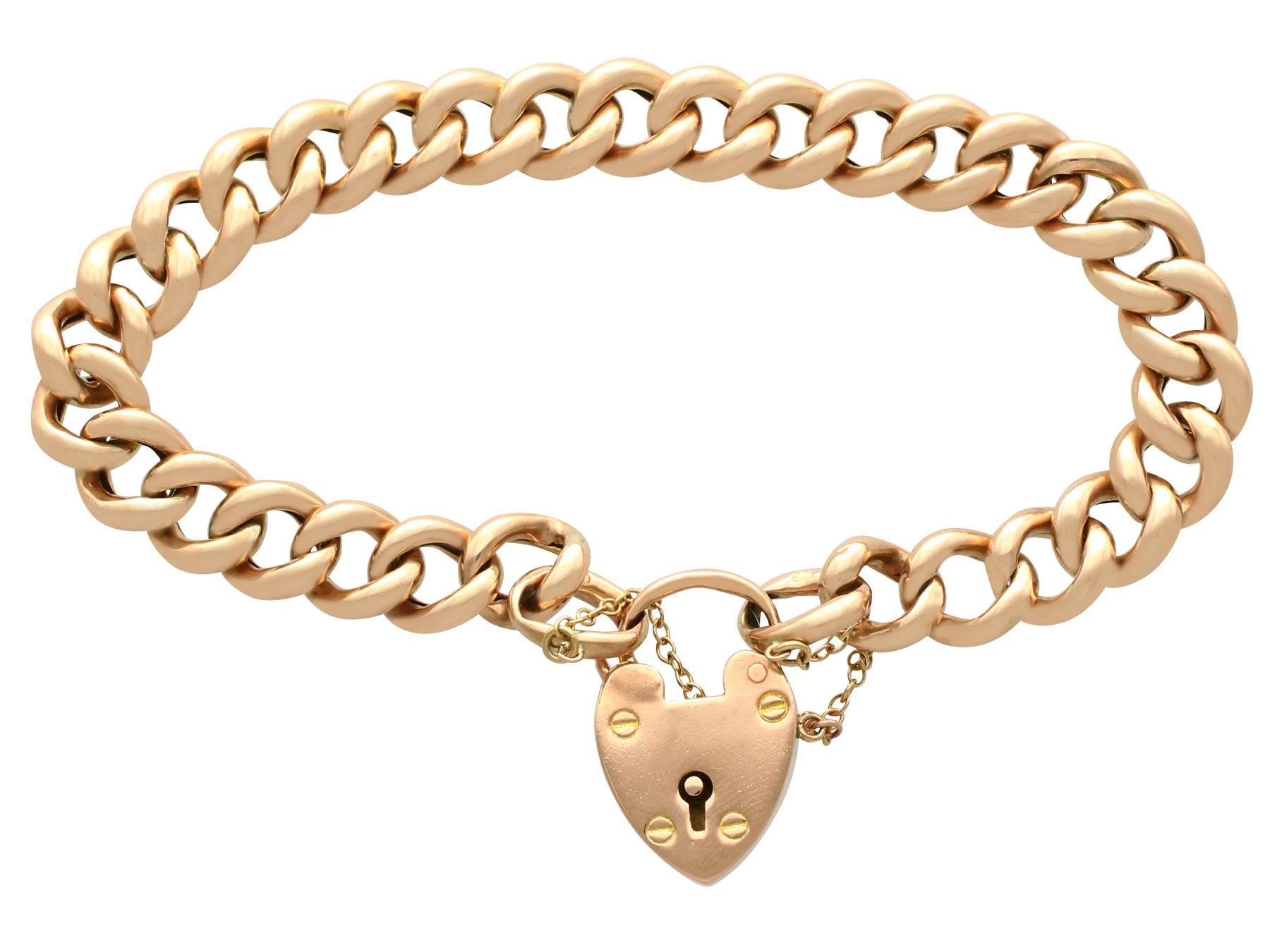 An impressive antique 9 karat yellow gold curb link bracelet with heart shaped padlock clasp; part of our diverse antique jewelry and estate jewelry collections.

This fine and impressive antique bracelet has been crafted in 9k yellow gold.

The