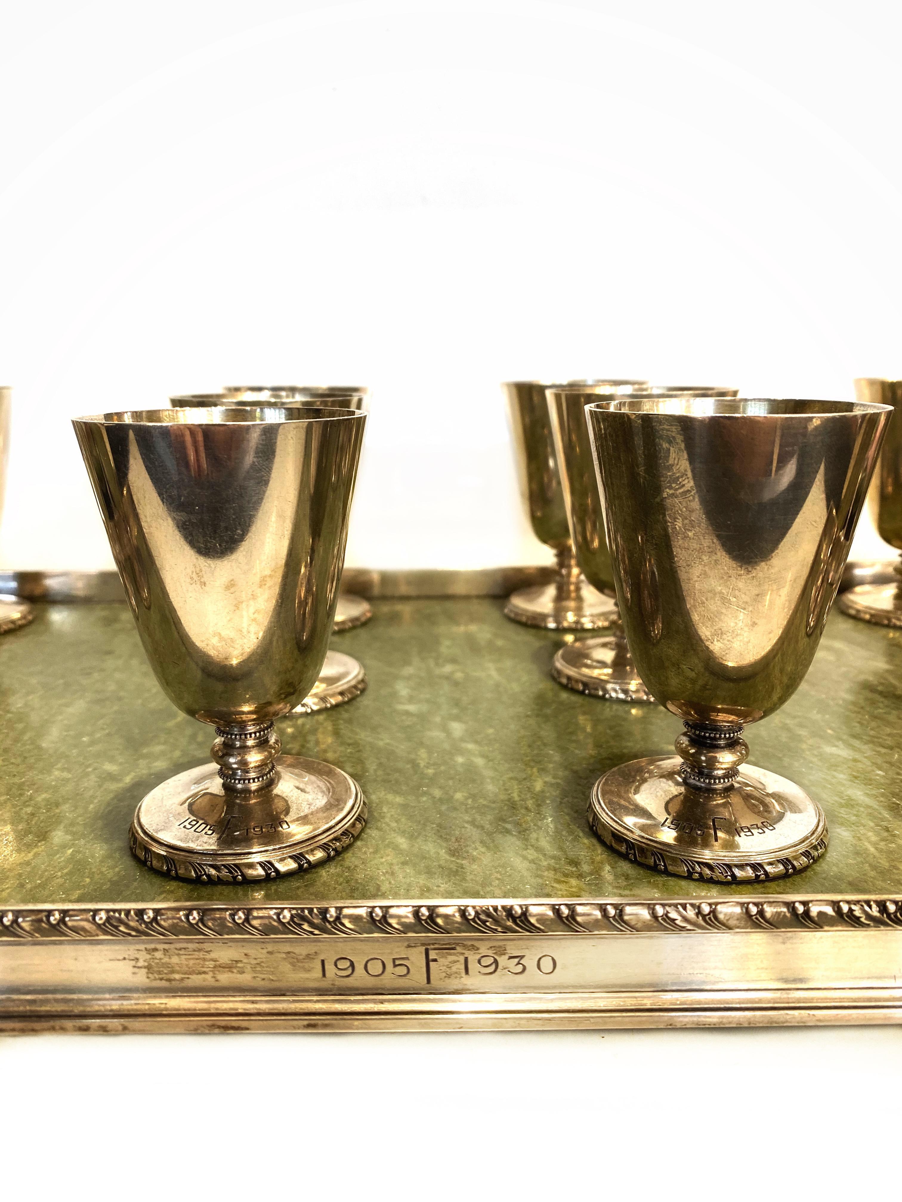 Antique 1905 - 1930 CARTIER Sterling Silver and Jade Tray and Chalice Cup Set

Product details:
The set is very rare, unique and one of the kind
 Sterling Silver and Jade 
The set includes 14 cups and 1 tray, total of 15 pieces
All pieces are signed