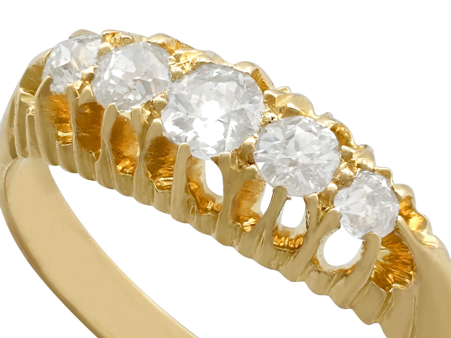 A fine and impressive antique 0.56 carat diamond and 18 karat yellow gold five stone cocktail ring; part of our diverse antique jewelry and estate jewelry collections.

This fine and impressive antique Edwardian diamond ring has been crafted in 18k