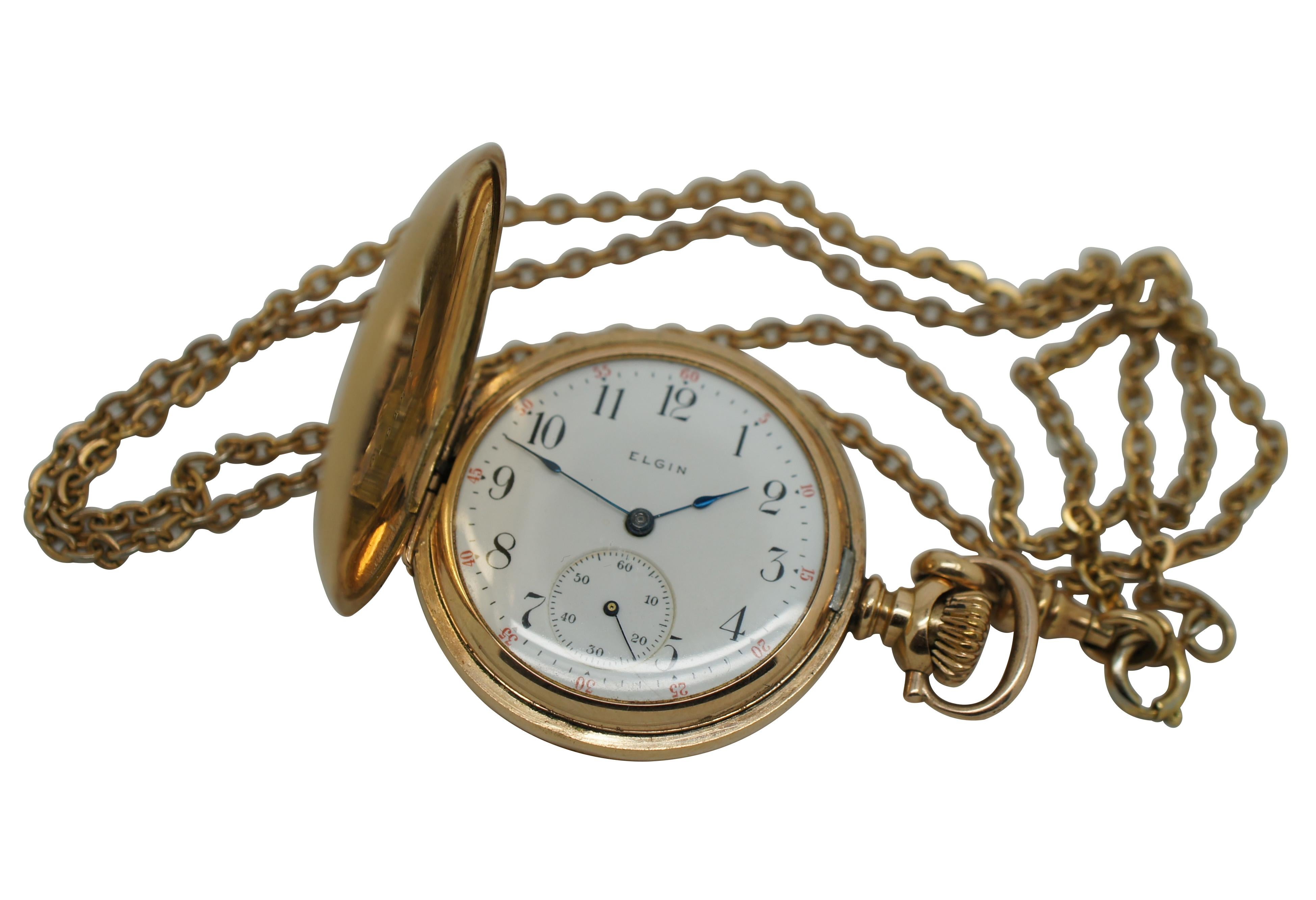 Antique early 20th century ladies pocket watch / time piece and chain by Elgin National Watch Company featuring a 14k gold filled Dueber Special case (numbered 6161739) sporting a textured diamond pattern and etched with a floral / foliate motif