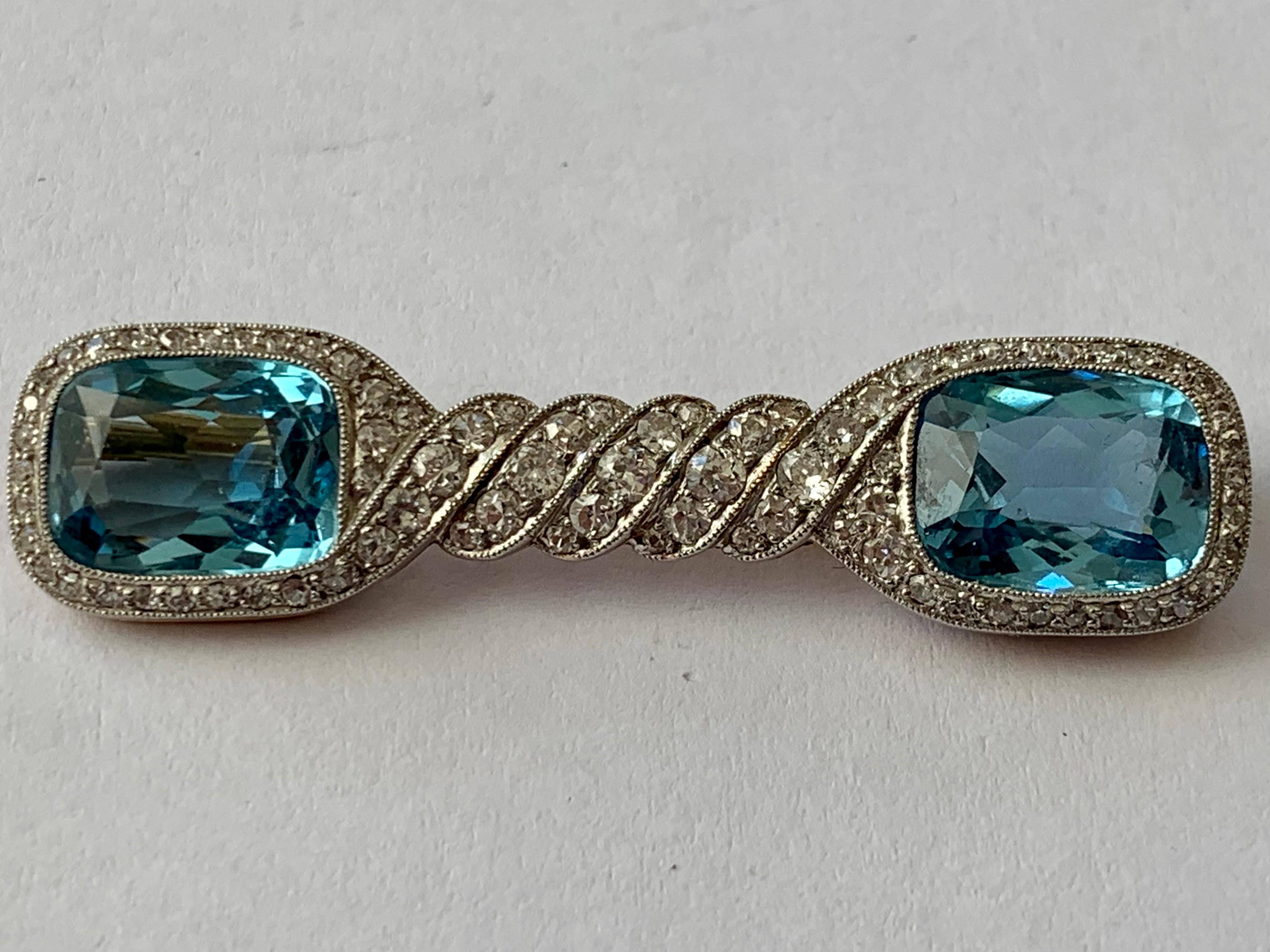 A stunning antique 1910 Aquamarine and Diamonds brooch mounted in Platinum over yellow Gold. Set with 2 beautiful Aquamarines weighing approximately 8 ct and approximately 1 ct of old European round cut Diamonds. 
An incredibly pretty piece of