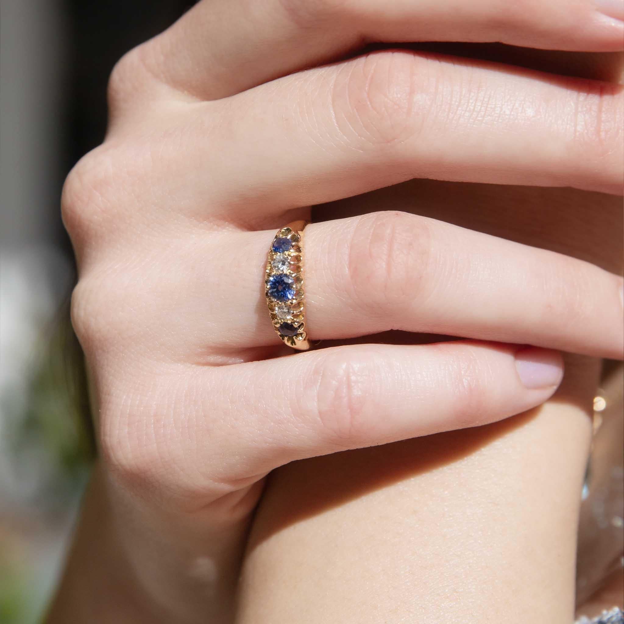 Our antique beauty is Antonia, her bridge setting is embellished with the brightest blue sapphires and sparkling diamonds. Crafted in 18 carat gold she is a jewel over one hundred years in the making.

The Antonia Ring Gem Details
The centre round
