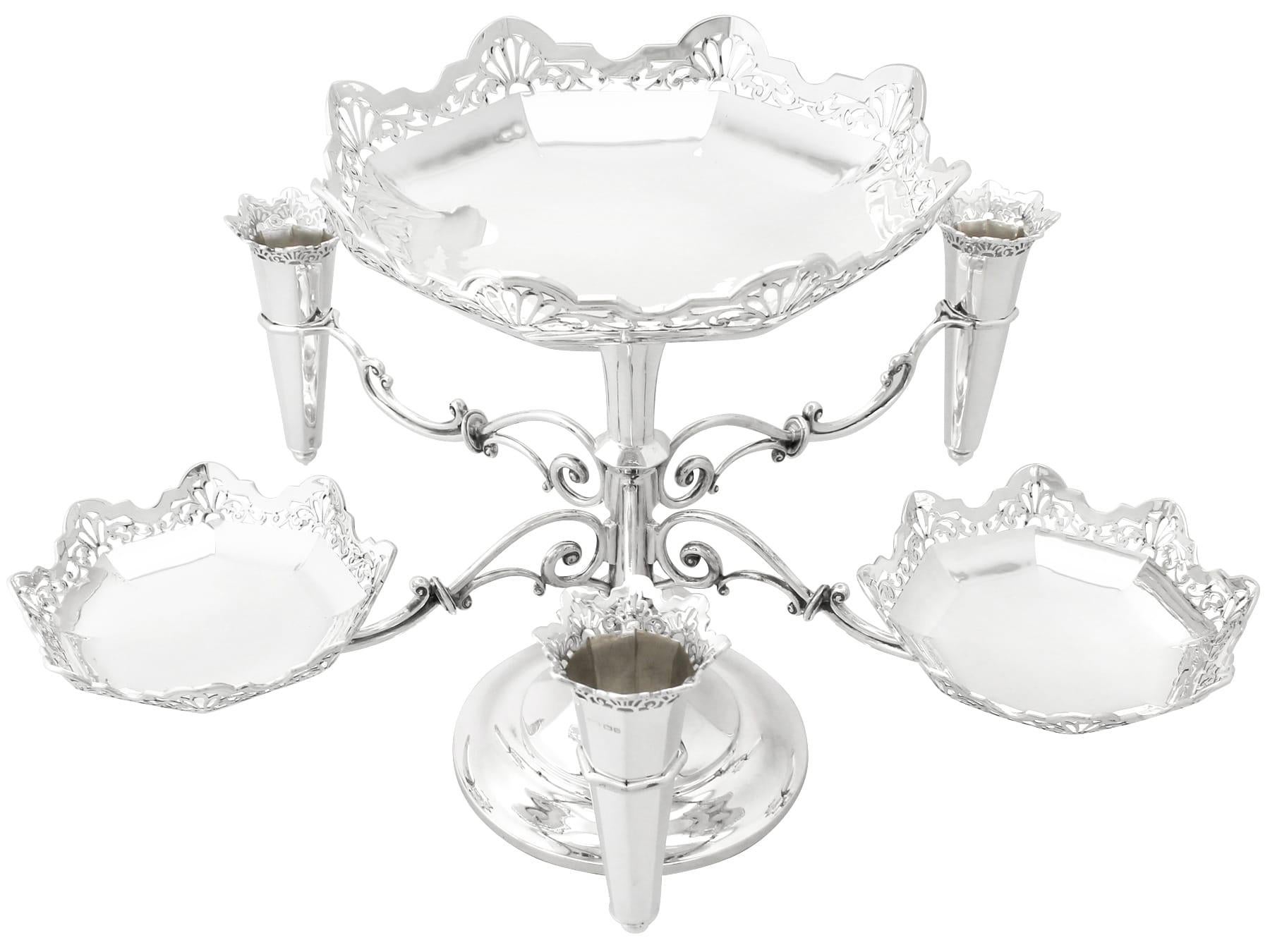 A magnificent, fine and impressive antique George V English sterling silver epergne/centrepiece; an addition to our ornamental silverware collection

This magnificent antique George V sterling silver centerpiece has a circular panelled form onto a