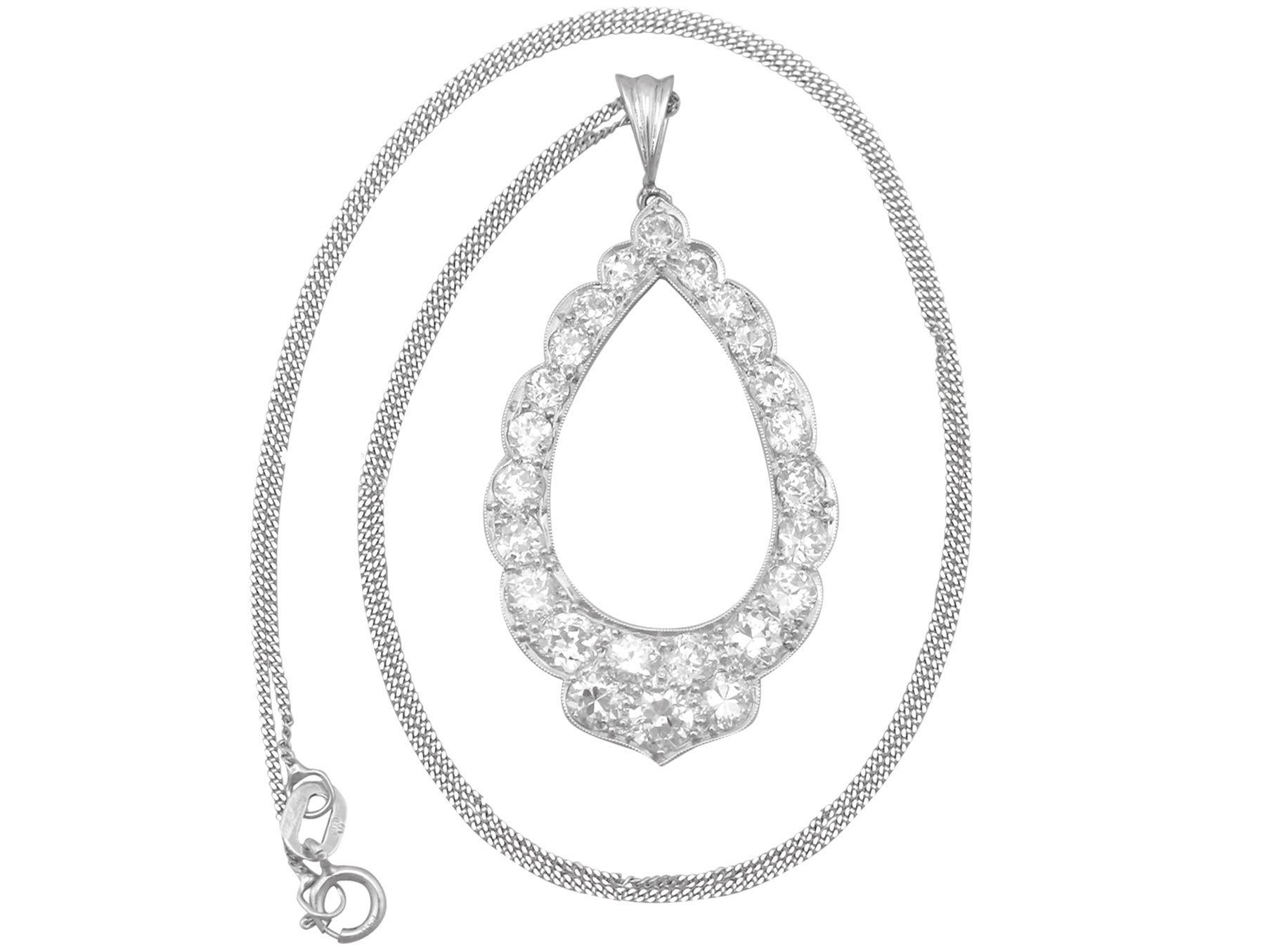 A stunning, fine and impressive antique 2.35Ct diamond and platinum pendant; part of our antique jewelry and estate jewelry collections.

This stunning, fine and impressive antique diamond pendant has been crafted in platinum.

The pierced decorated