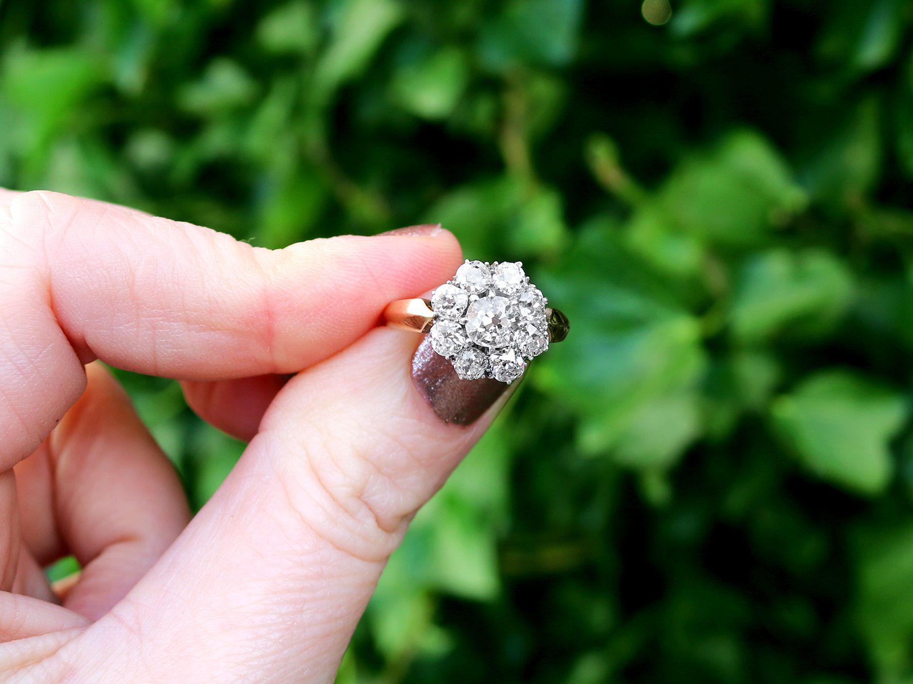 A fine and impressive antique 2.39 carat diamond (total) cluster ring in 14k yellow gold with silver settings; part of our antique jewelry and estate jewelry collections.

This impressive antique diamond cluster ring has been crafted in 14k yellow