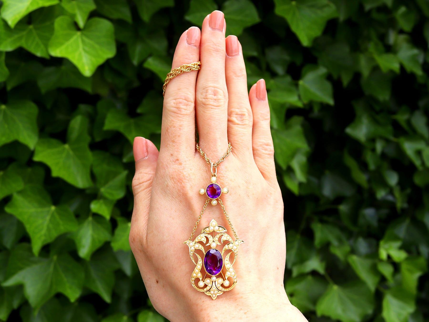 An impressive antique 4.83 carat amethyst and seed pearl, 18 karat yellow gold pendant and 9 karat yellow gold chain; part of our diverse antique jewelry and estate jewelry collections.

This stunning, fine and impressive Edwardian amethyst necklace