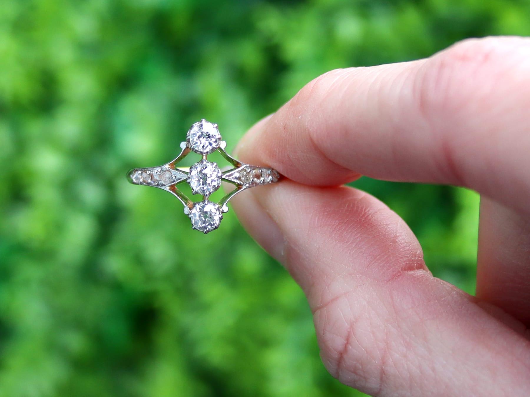 An impressive antique 0.70 carat diamond and 18 karat rose gold, platinum set trilogy style dress ring; part of our diverse antique jewelry and estate jewelry collections.

This fine and impressive diamond trilogy ring has been crafted in 18k rose