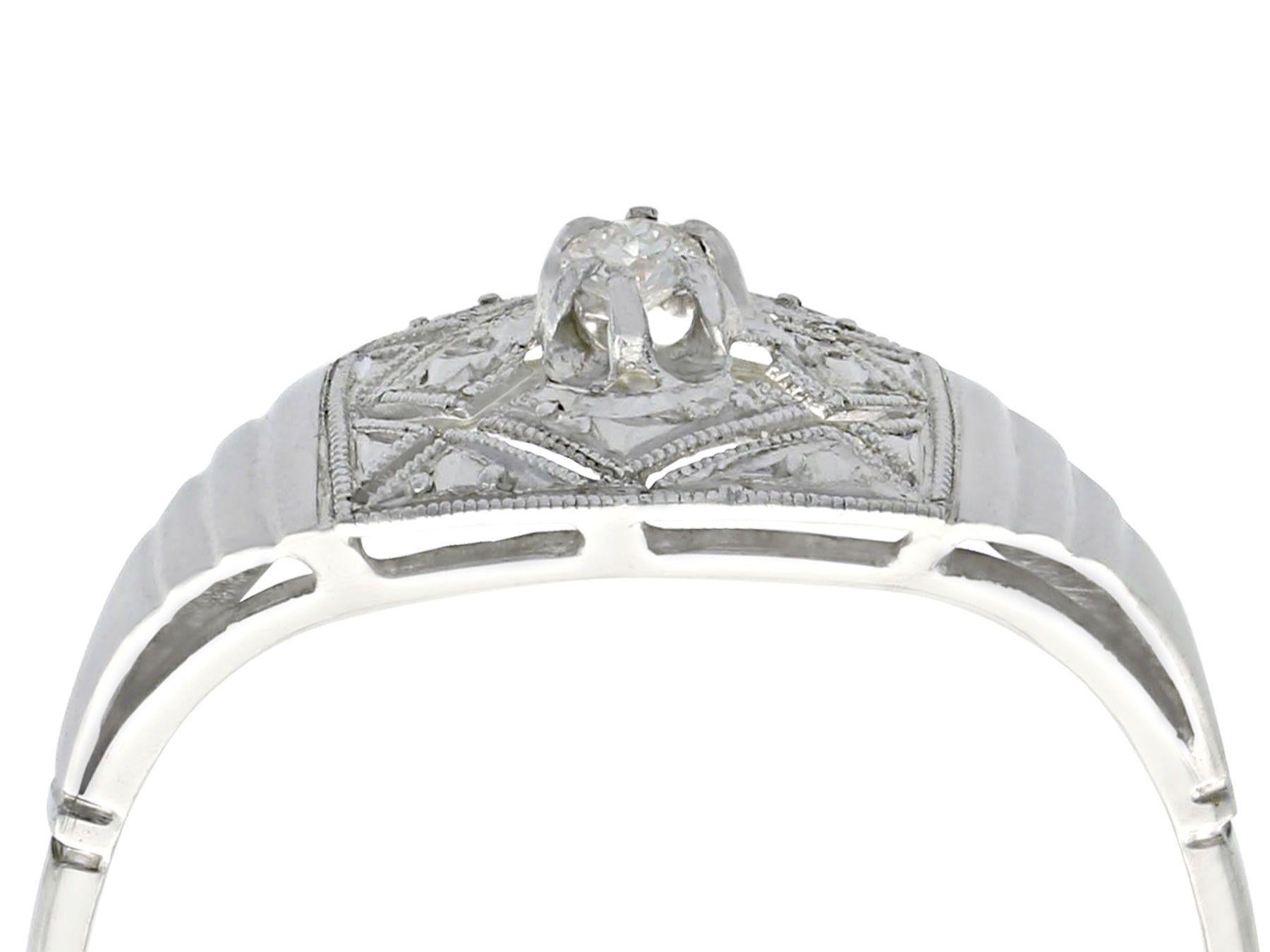 A fine and impressive antique 0.04 carat diamond and 18 karat white gold, platinum set cocktail ring; part of our diverse antique jewelry and estate jewelry collections.

This fine and impressive diamond cocktail ring has bee crafted in 18k white