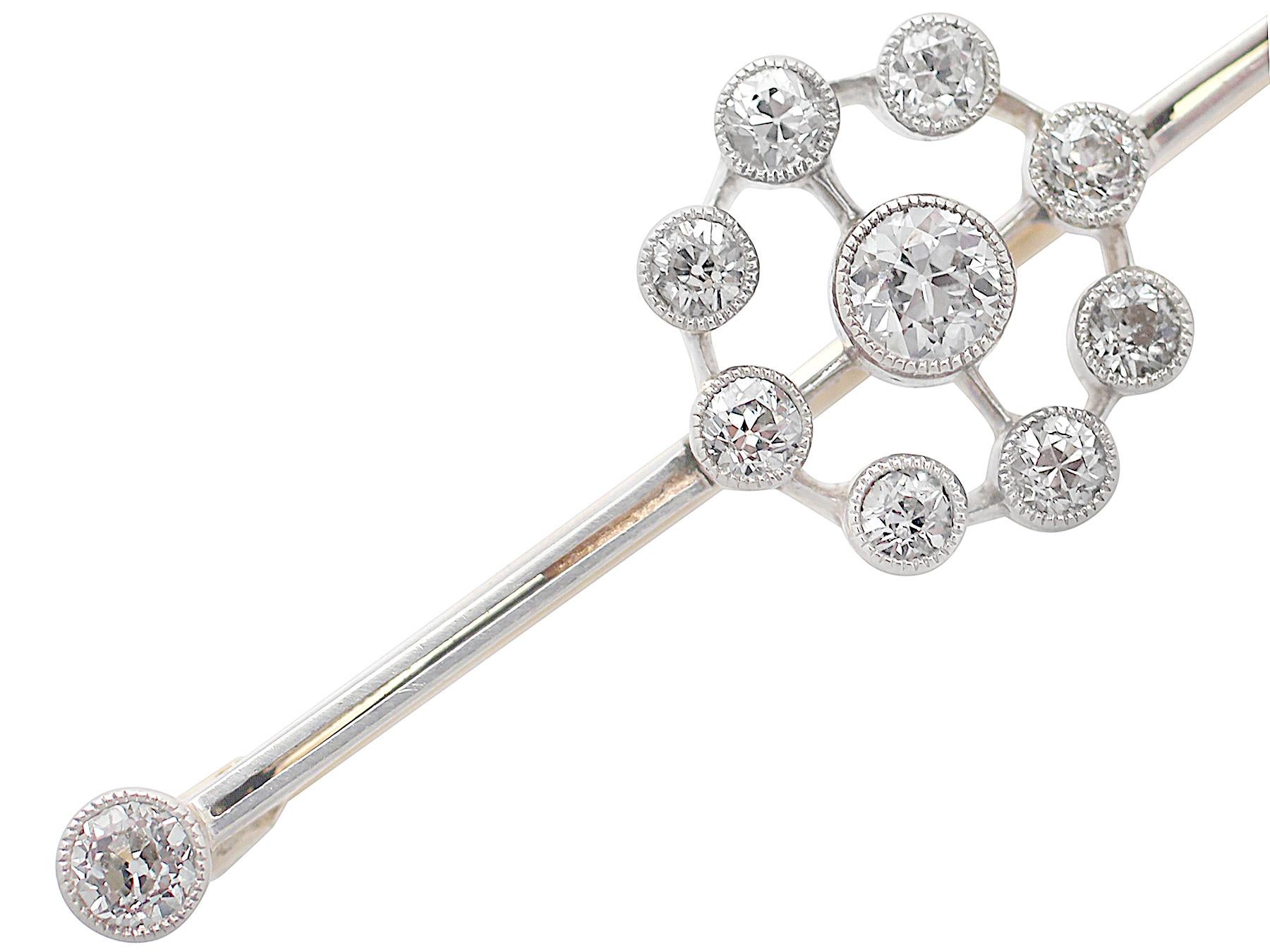 A fine and impressive antique 0.92 carat diamond and 18 karat yellow gold, platinum set bar brooch; part of our antique jewelry and estate jewelry collections.

This fine antique diamond bar brooch has been crafted in 18k yellow gold with a platinum