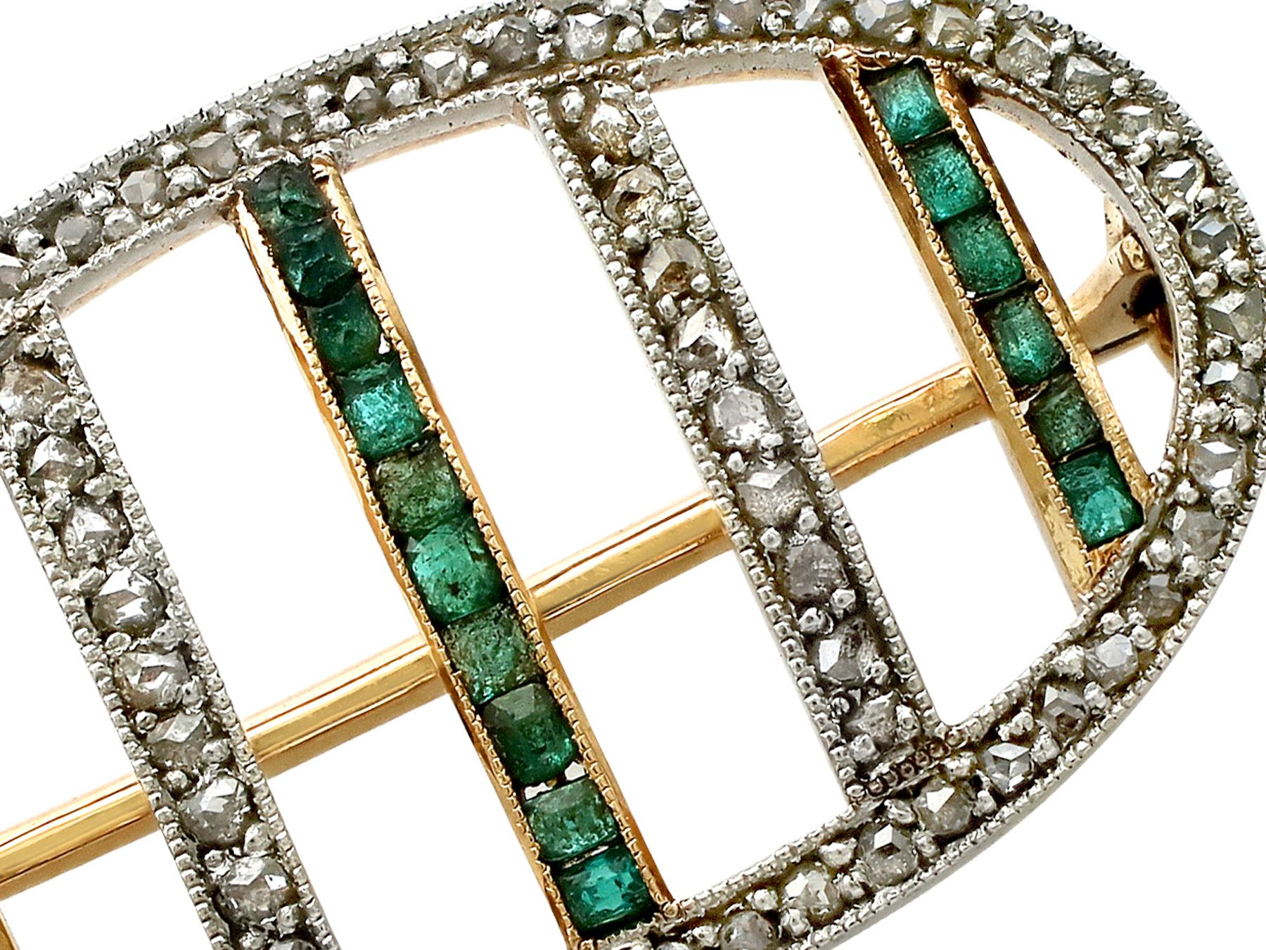 A fine and impressive antique 0.22 carat natural emerald and 0.39 carat diamond, 18 karat yellow gold, platinum set brooch; part of our antique jewelry and estate jewelry collections.

This impressive antique emerald brooch has been crafted in 18k