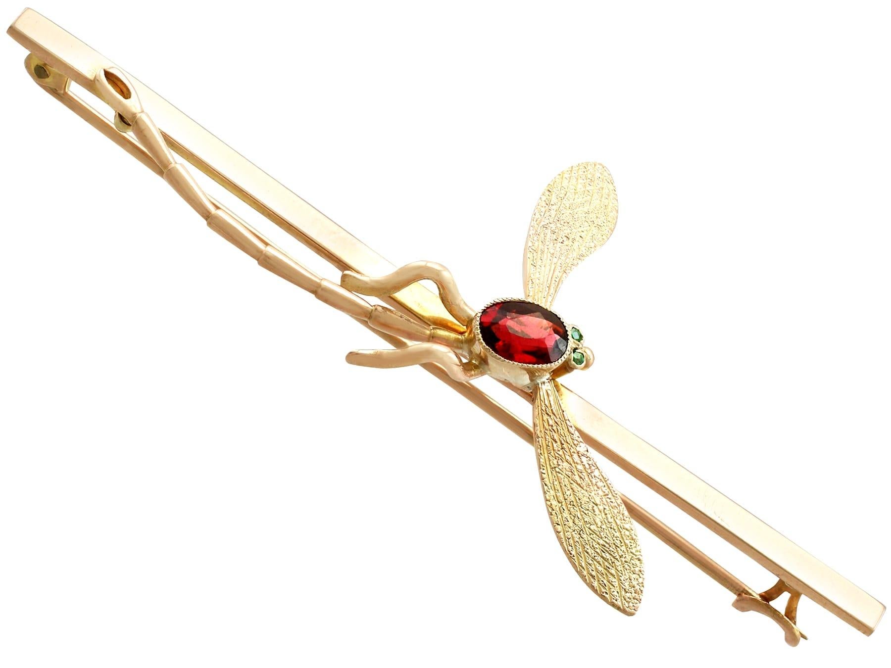 Oval Cut Antique 1910s Emerald and Garnet Yellow Gold Dragonfly Brooch For Sale