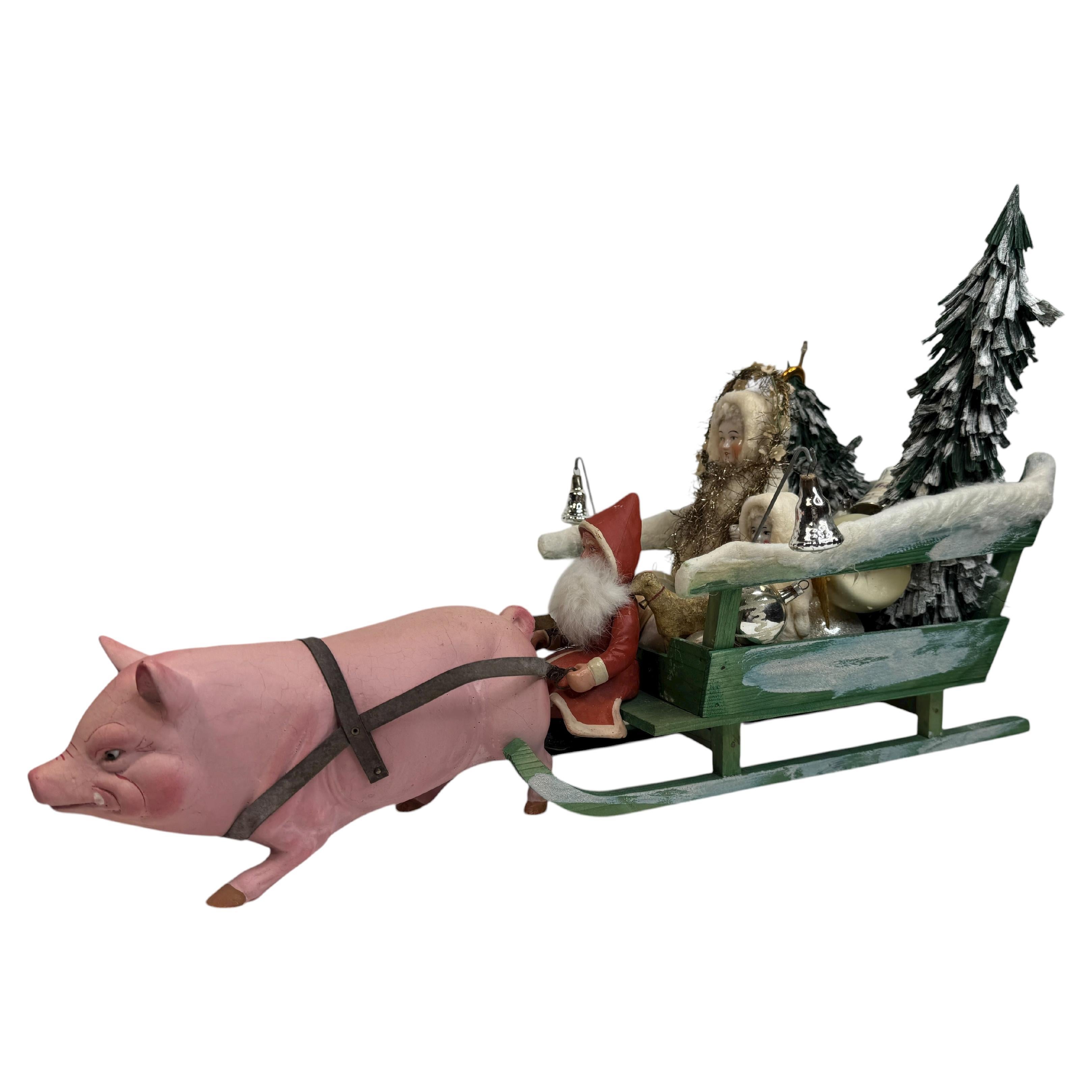 Antico Babbo Natale tedesco del 1910 con figura di Belsnickle su slitta trainata da un maiale rosa