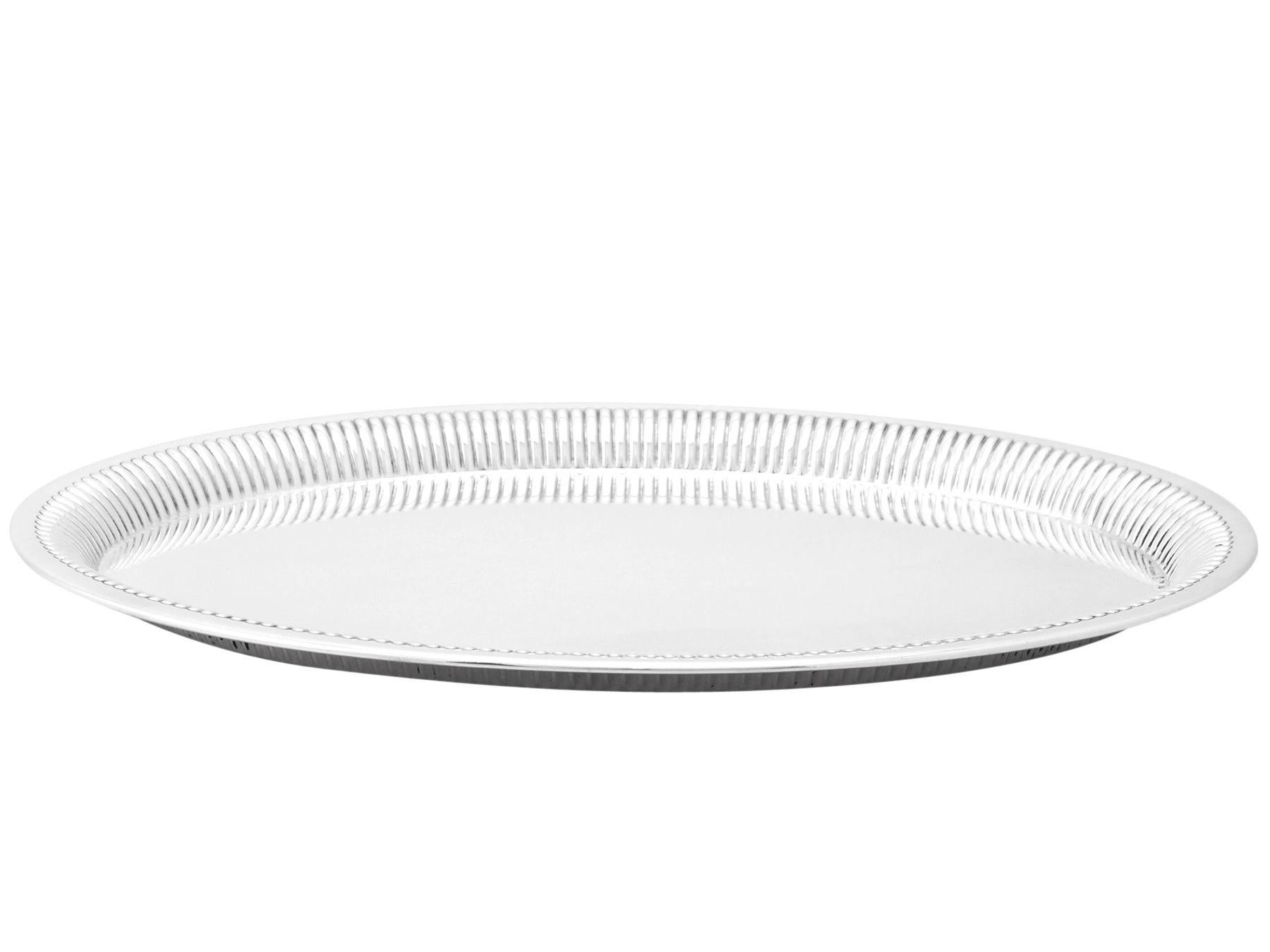 A fine antique German 800 standard silver salver; an addition to our continental silver collection.

This fine antique German 800 standard silver salver has plain oval form.

The surface of the silver salver is plain and unembellished.

The raised