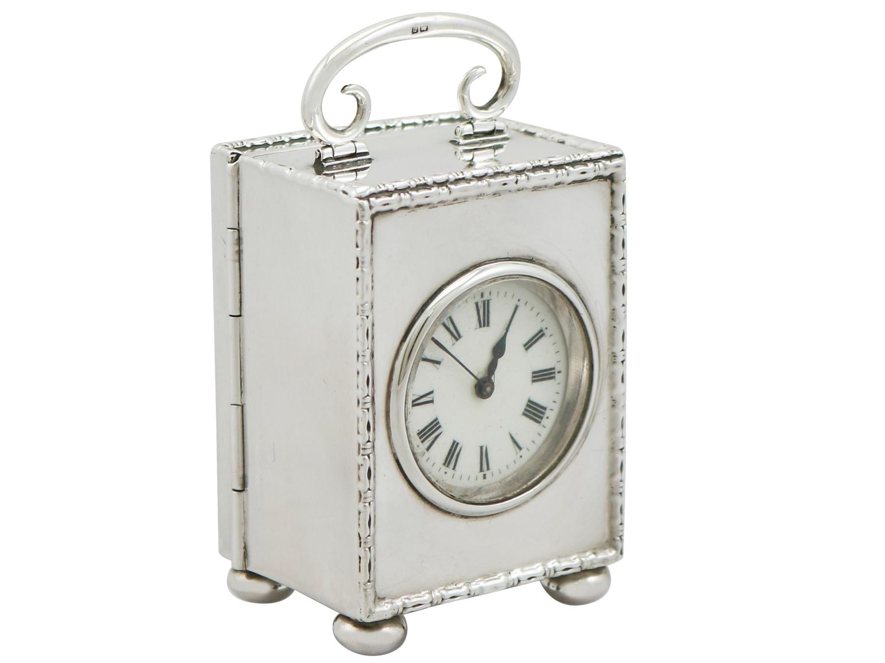 An exceptional, fine and impressive antique George V English sterling silver boudoir clock; part of our antique silver timepiece collection

This exceptional antique George V boudoir clock in sterling silver has a plain rectangular form onto four