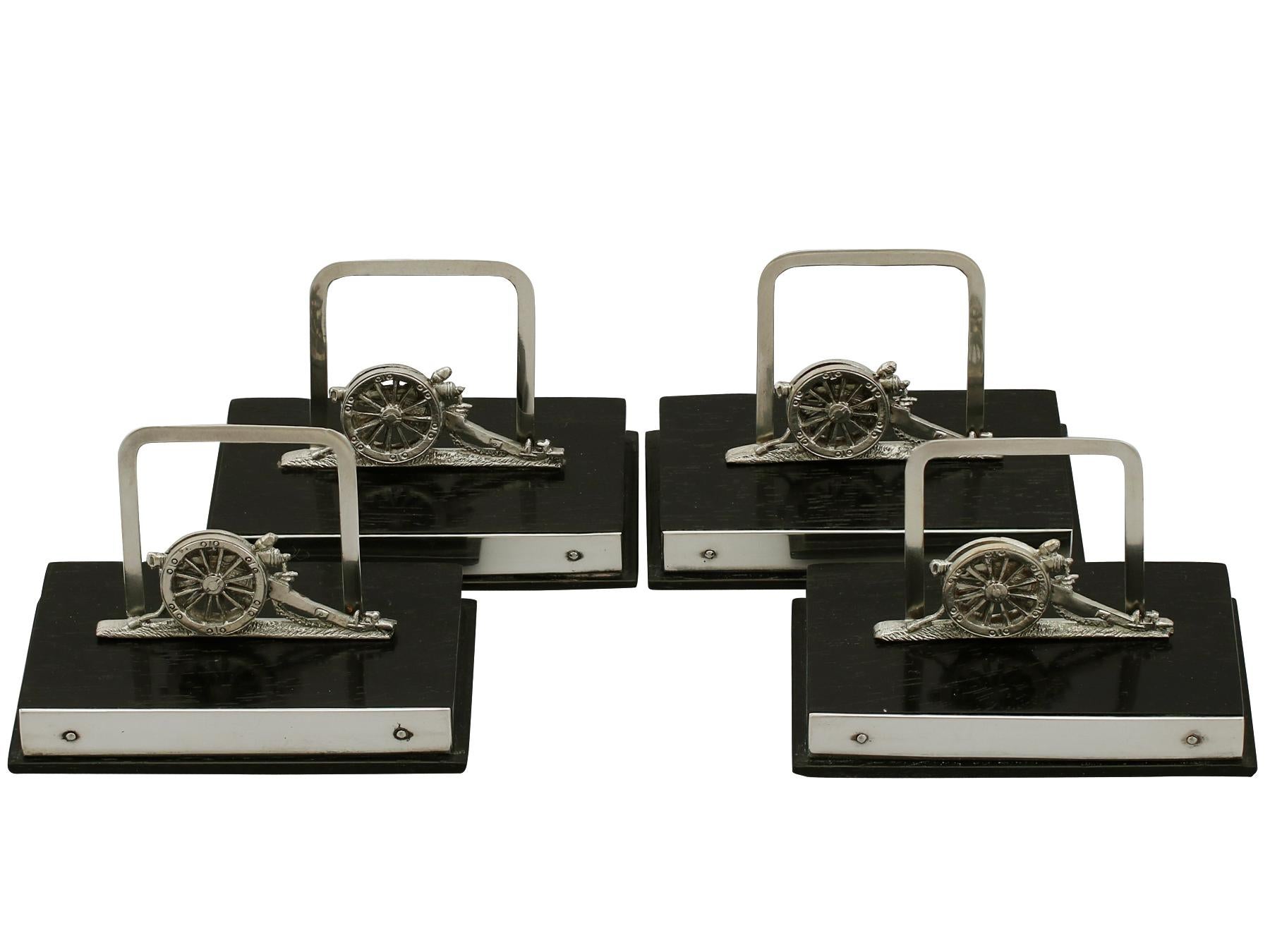 A fine and impressive set of four antique George V English sterling silver and wood menu holders in the form of a single barrelled cannon - boxed; an addition to our dining silverware collection.

These fine George V sterling silver menu holders
