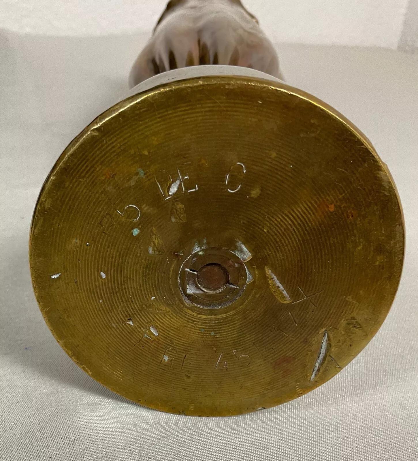 This antique 1917 shell casing is a remarkable example of trench art, crafted with care and skill during the First World War (1914–1918). Made in France, this piece reflects the creativity and resilience of soldiers who repurposed war materials into