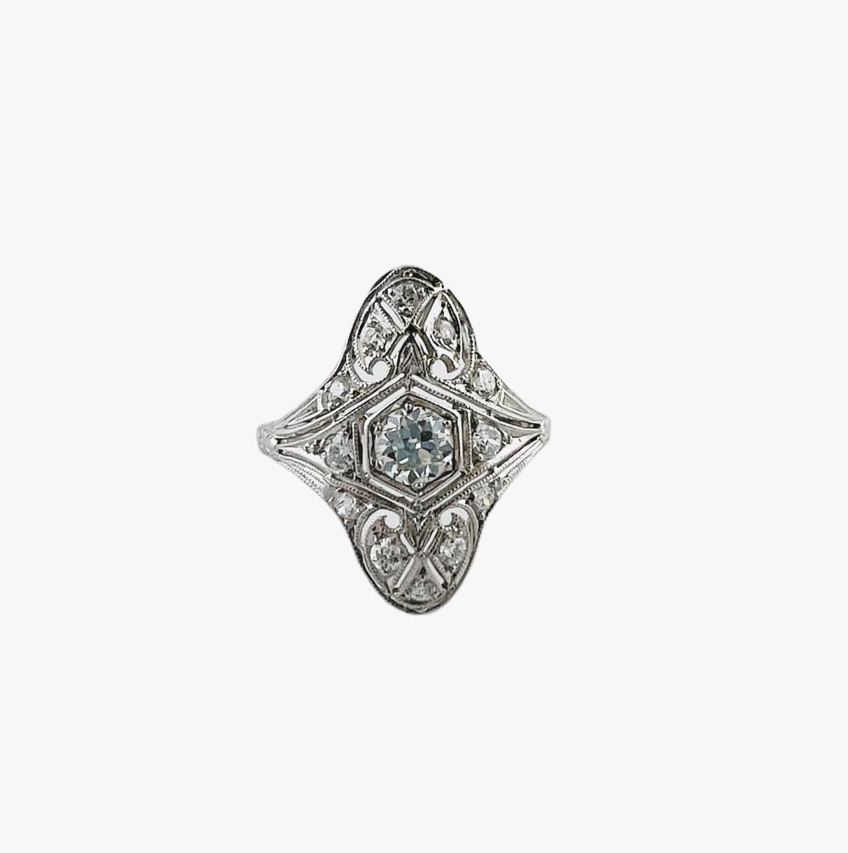 Antique Tiffany & Co. Diamond Art Deco Ring

This gorgeous diamond filigree ring by Tiffany & Co. is set in platinum.

Center transitional cut diamond (older round brilliant) is approx. .40cts

Surrounding transitional cut diamonds total approx. .30