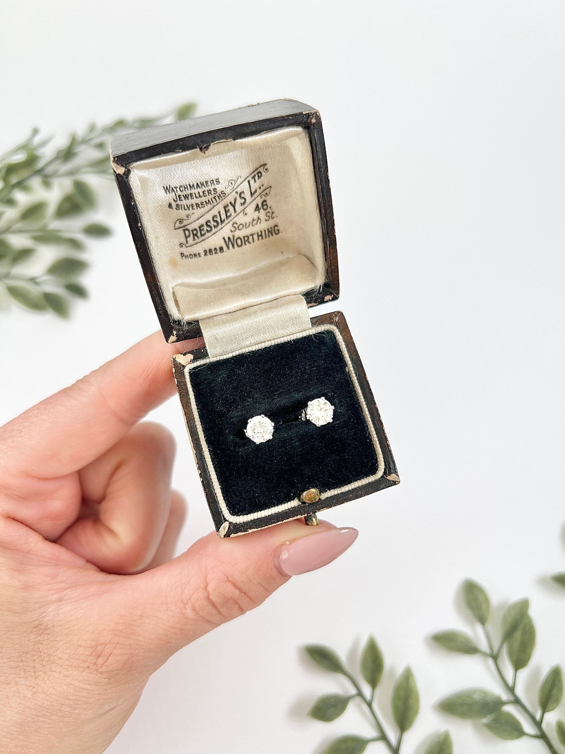 Diamond Stud Earrings 

18ct White Gold Stamped 750

Circa 1920s

Introducing these stunning modern 18ct white gold diamond stud earrings, elegantly stamped with 750 for authenticity. The diamonds have been taken from a 1920s pair of earrings and