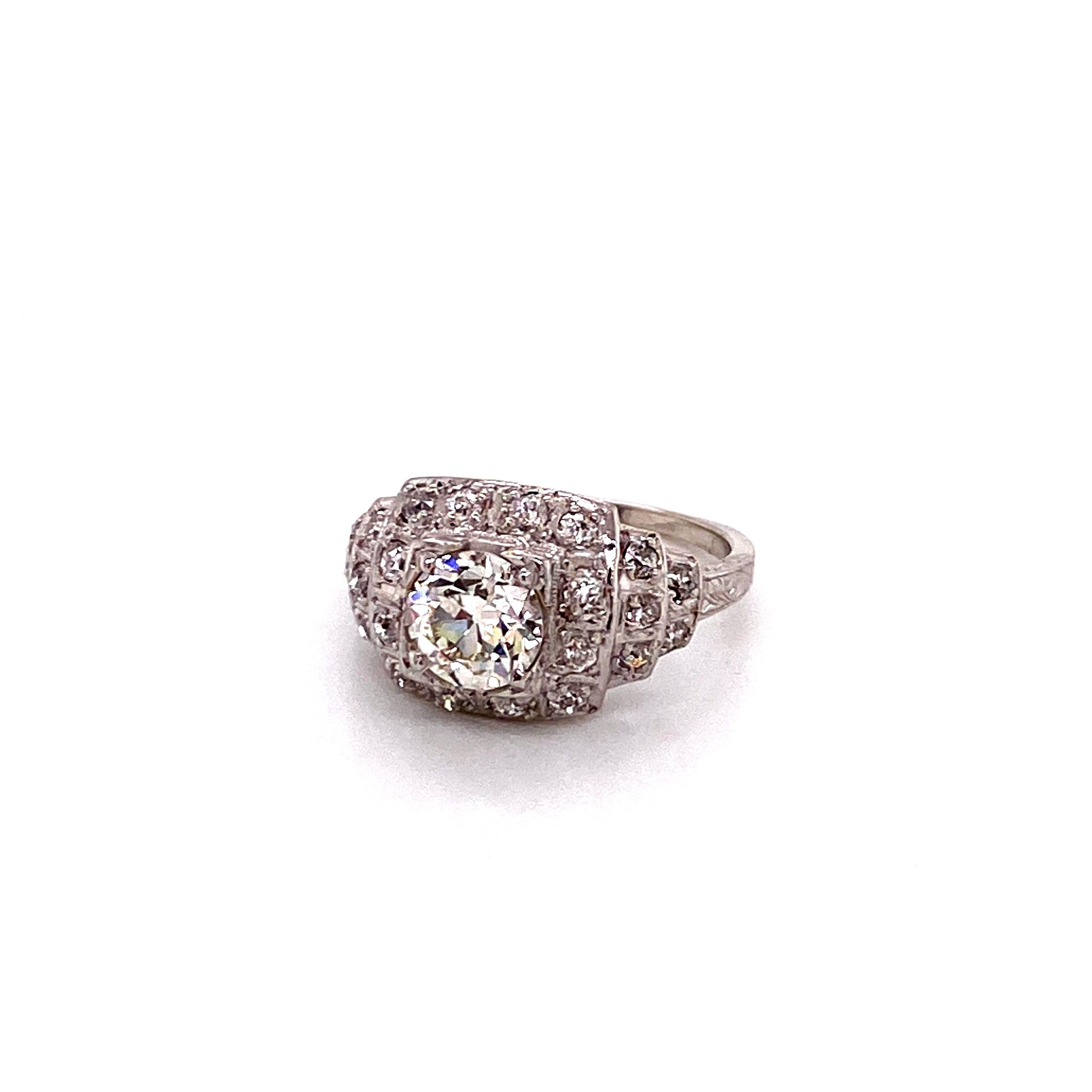 Antique 1920s European Cut Diamond Platinum Art Deco Ring - The center European Cut diamond weighs 1.17ct with K color and VS1 clarity. The diamond is set in a 3 tiered square Art Deco platinum setting containing 22 Miner cut diamonds that weigh
