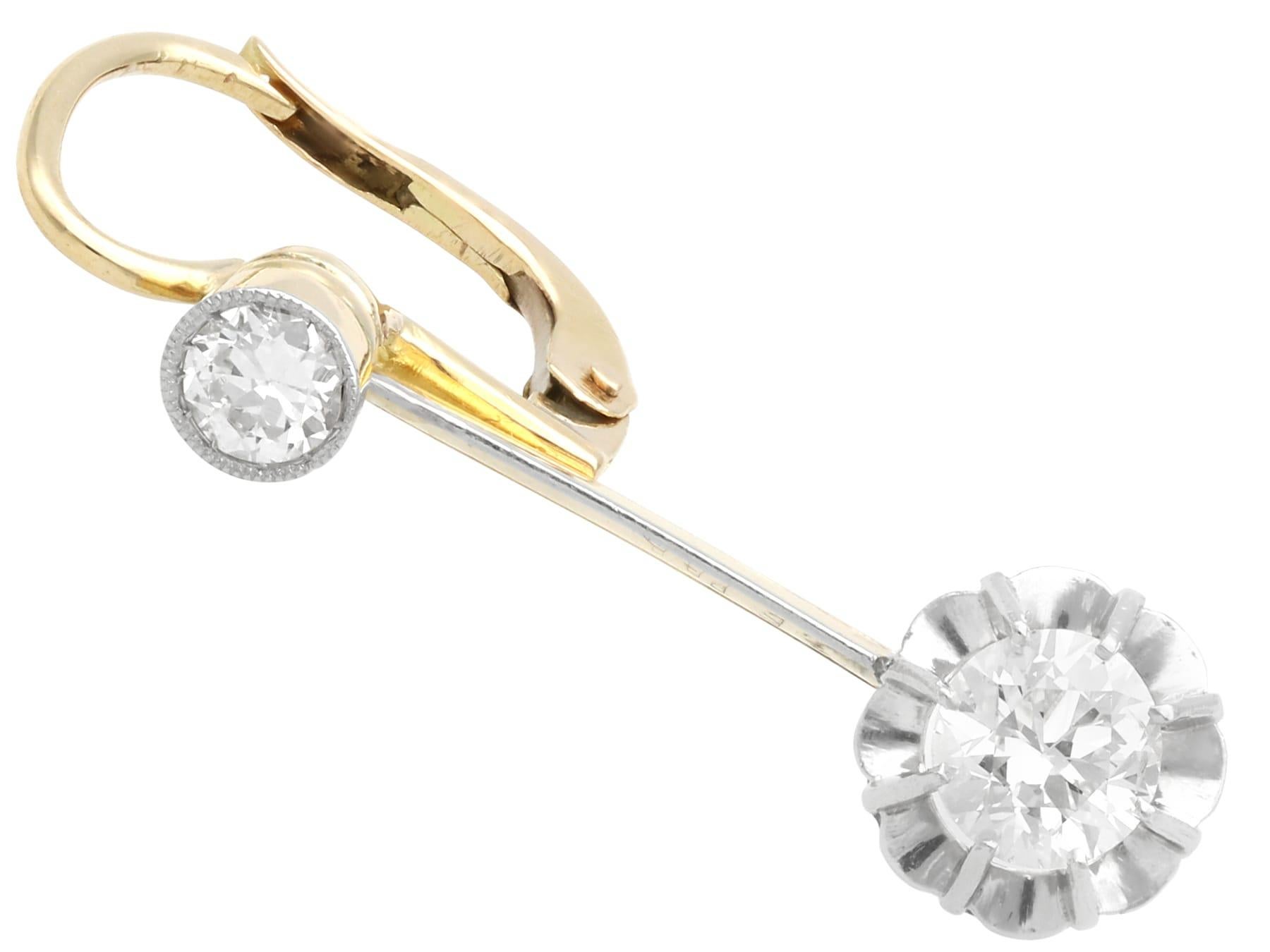 A fine and impressive pair of antique 1.40 carat diamond and 15 karat yellow gold, platinum set drop earrings; part of our 1920s diamond jewellery collections.

These fine and impressive antique diamond earrings have been crafted in 15k yellow gold