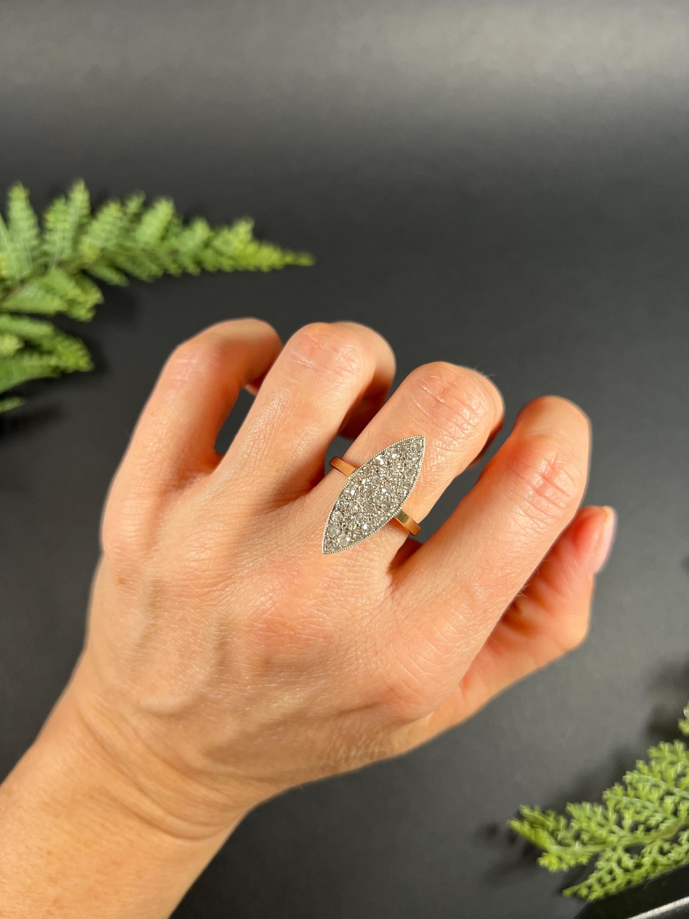 Antique Diamond Ring 

18ct Yellow Gold & Platinum Tested

Circa 1920s

This stunning 1920s statement ring features a marquise-shaped design that is sure to turn heads. The ring is set with approximately 1.50 carats of natural diamonds that sparkle