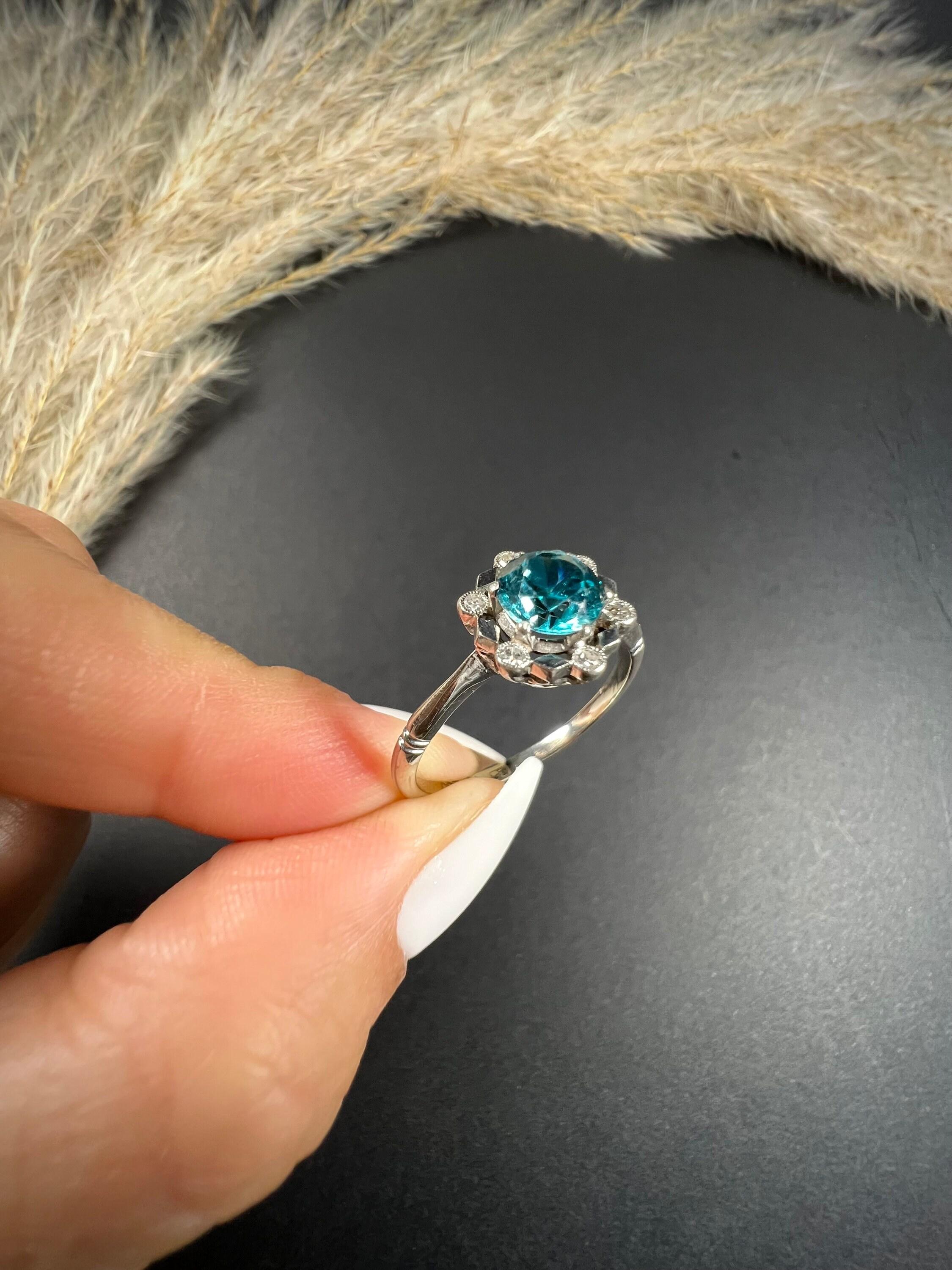 Antique Zircon & Diamond Ring 

9ct White Gold & Platinum Stamped

Makers Mark A & W

Circa 1920's

This stunning Art Deco ring truly represents the glamour and elegance of the era. Crafted from 18ct white gold and platinum, this ring features a