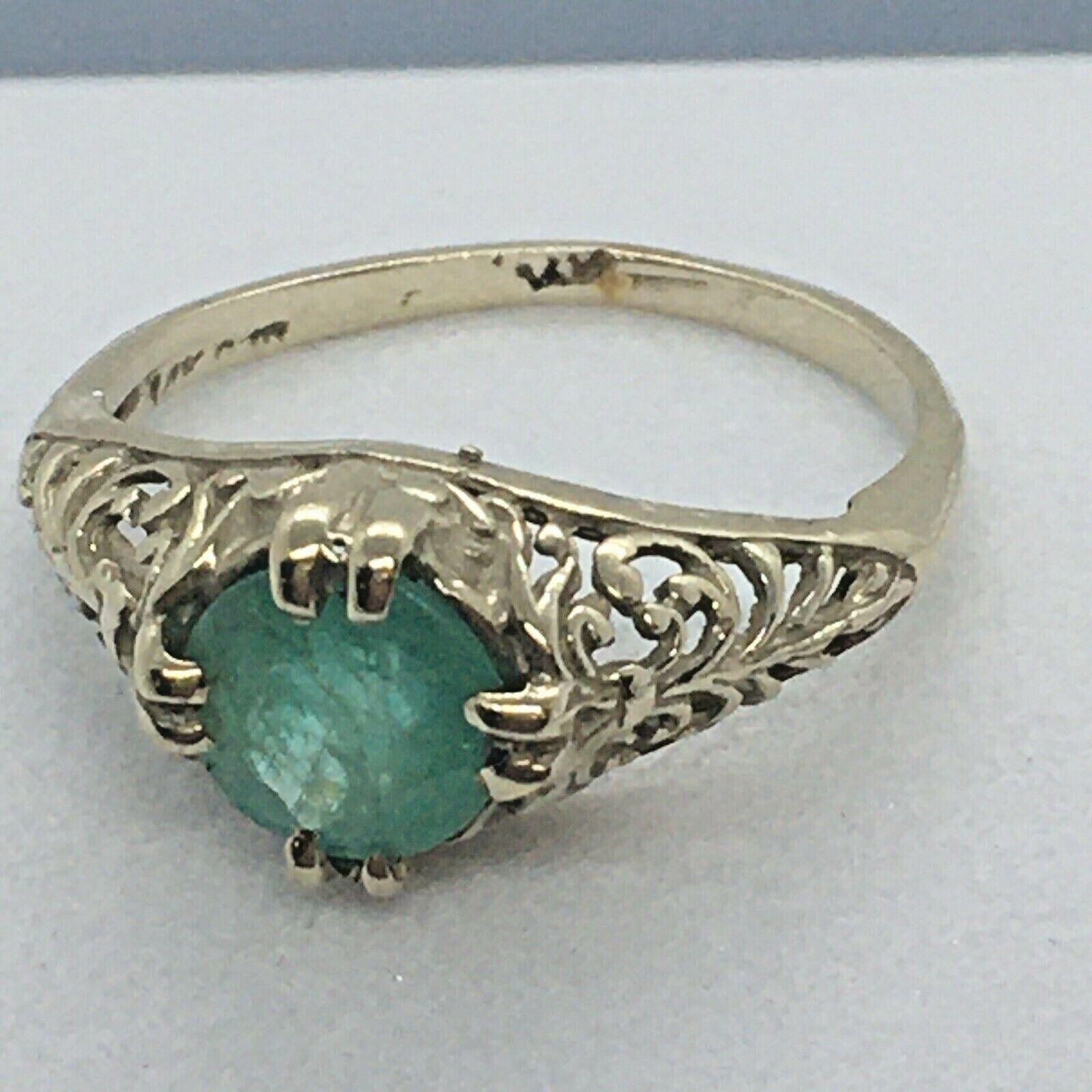 Antique 1920s 6.5mm Round Colombian Emerald 14k White Gold Filigree Ring

Size 3.5
Weighing 1.7 grams
In fair condition considering 100 years of age, see pictures
Natural 6.5 mm round Columbian Emerald
Marked, tested 14K Gold
Art Deco era circa