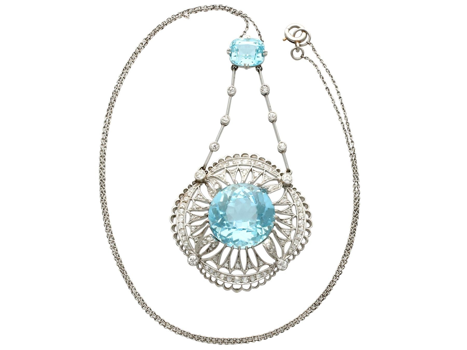 A stunning antique 10.97 carat aquamarine and 1.57 carat topaz, 1.42 carat diamond and platinum necklace; part of our diverse antique jewelry and estate jewelry collections.

This stunning, fine and impressive antique pendant has been crafted in