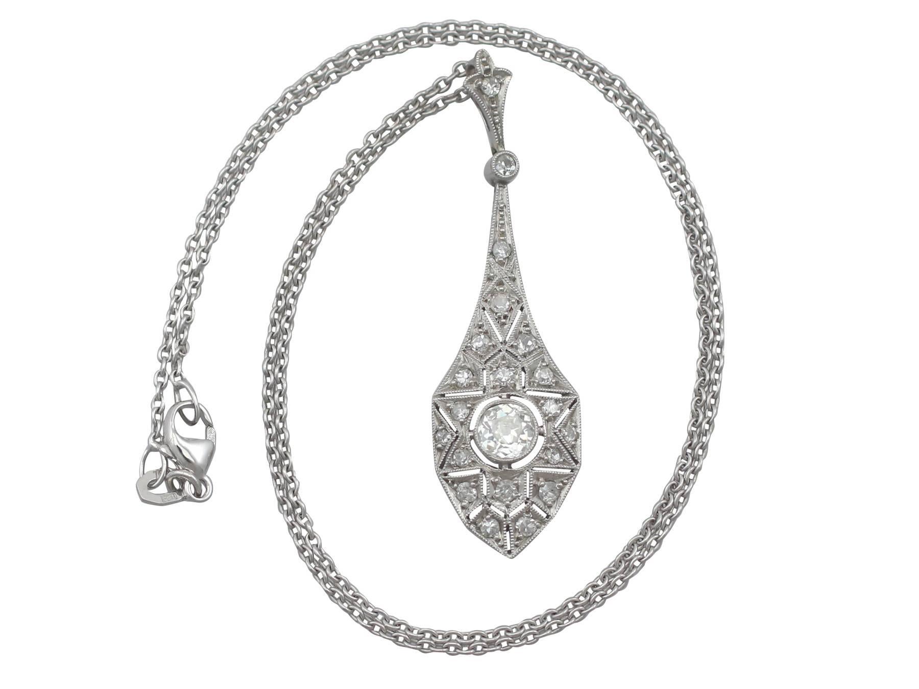 A stunning antique 1920s Art Deco 0.94 carat diamond and 18 karat white gold pendant; part of our diverse diamond jewellery and estate jewelry collections.

This stunning, fine and impressive antique Art Deco necklace has been crafted in 18k white