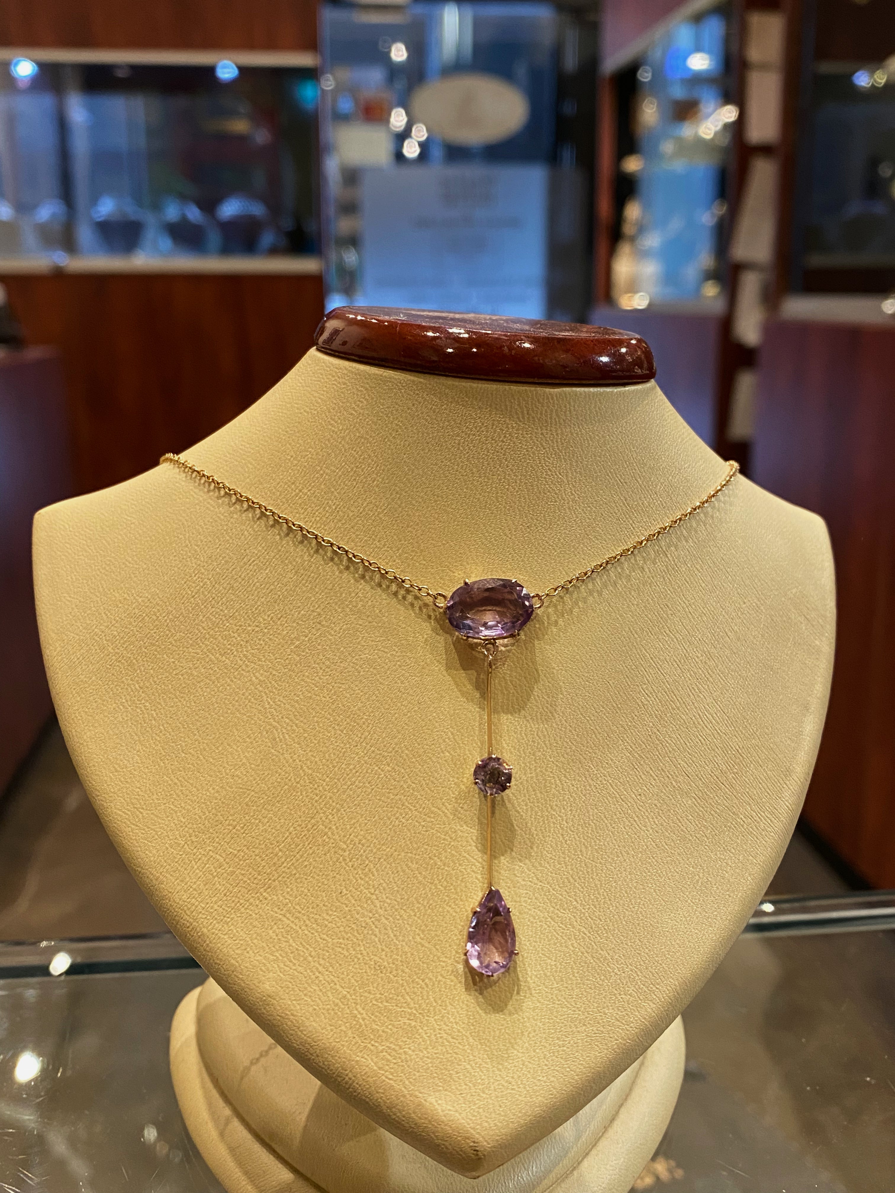 This delightful Art-Nouveau piece is antique, dating back to circa 1920’s

Drop centrepiece is 54mm long & features
3 natural amethysts of striking violet purple colour
(which looks even more beautiful against the skin)
& of excellent clarity:
1 x