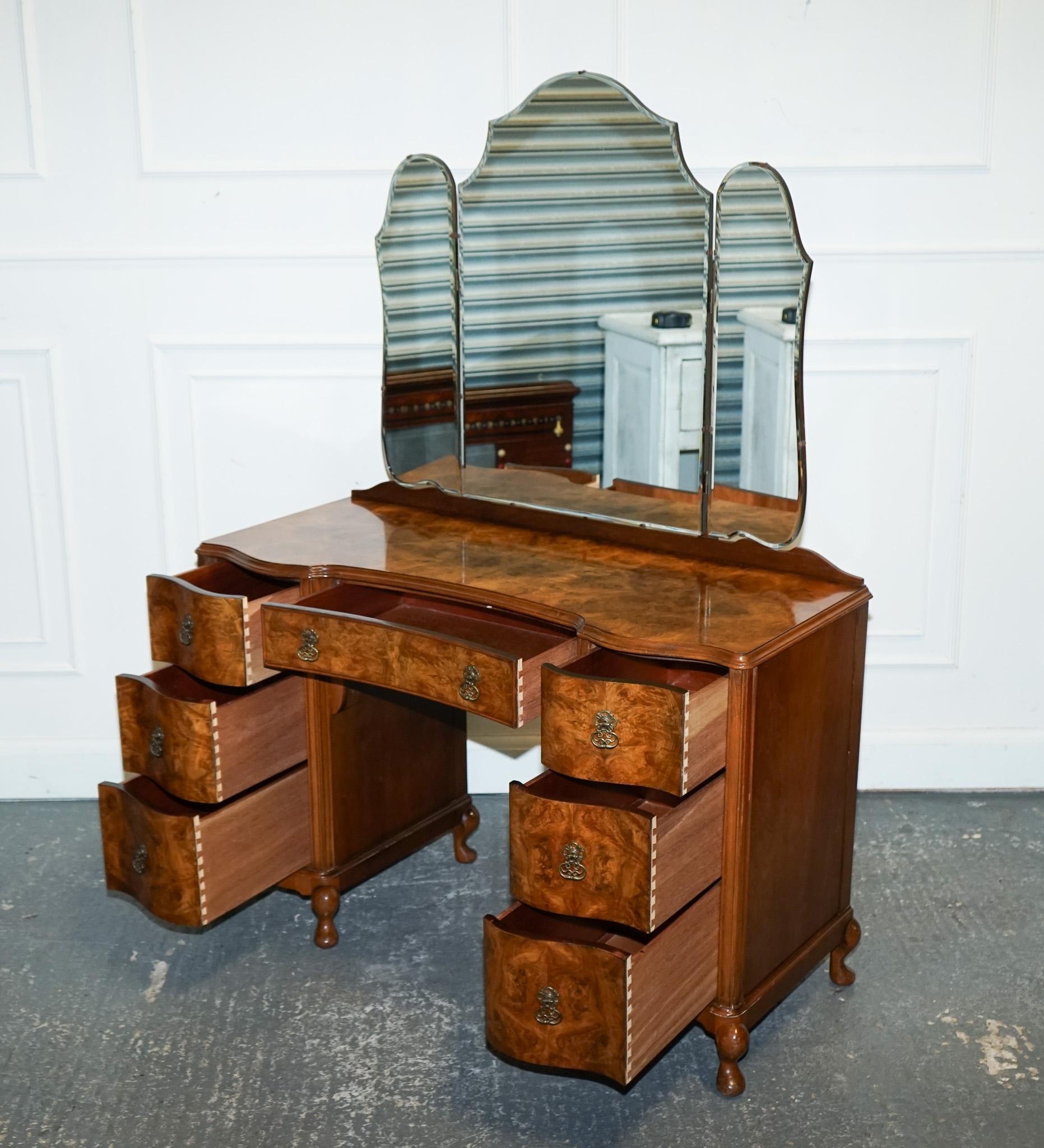 Antiques of London



We are delighted to offer for sale This Exquisite Antique 1920s Burr Walnut Art Deco Dressing Table.

 Is a stunning example of the craftsmanship and design aesthetic of the era. The table is characterised by its rich burr