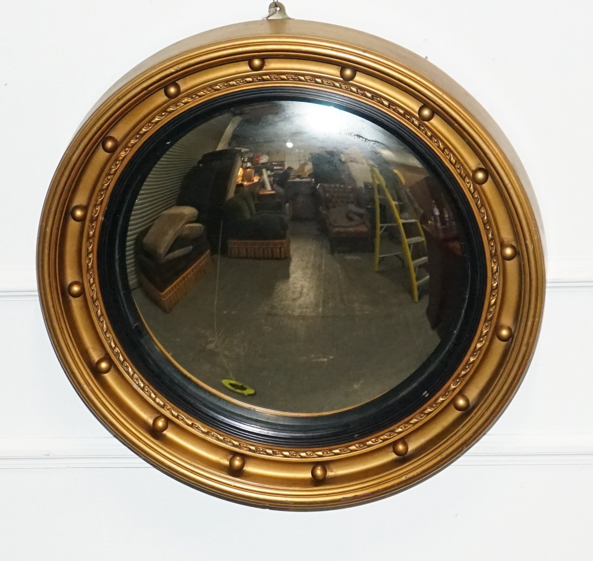 
Antiques of London



We are delighted to offer for sale this Elegant Antique Butler's Mirror.

 Dating back to the 1920s. This convex wall mirror features a striking black and gold gilt wood frame, adding a touch of Art Deco glamour to any space.