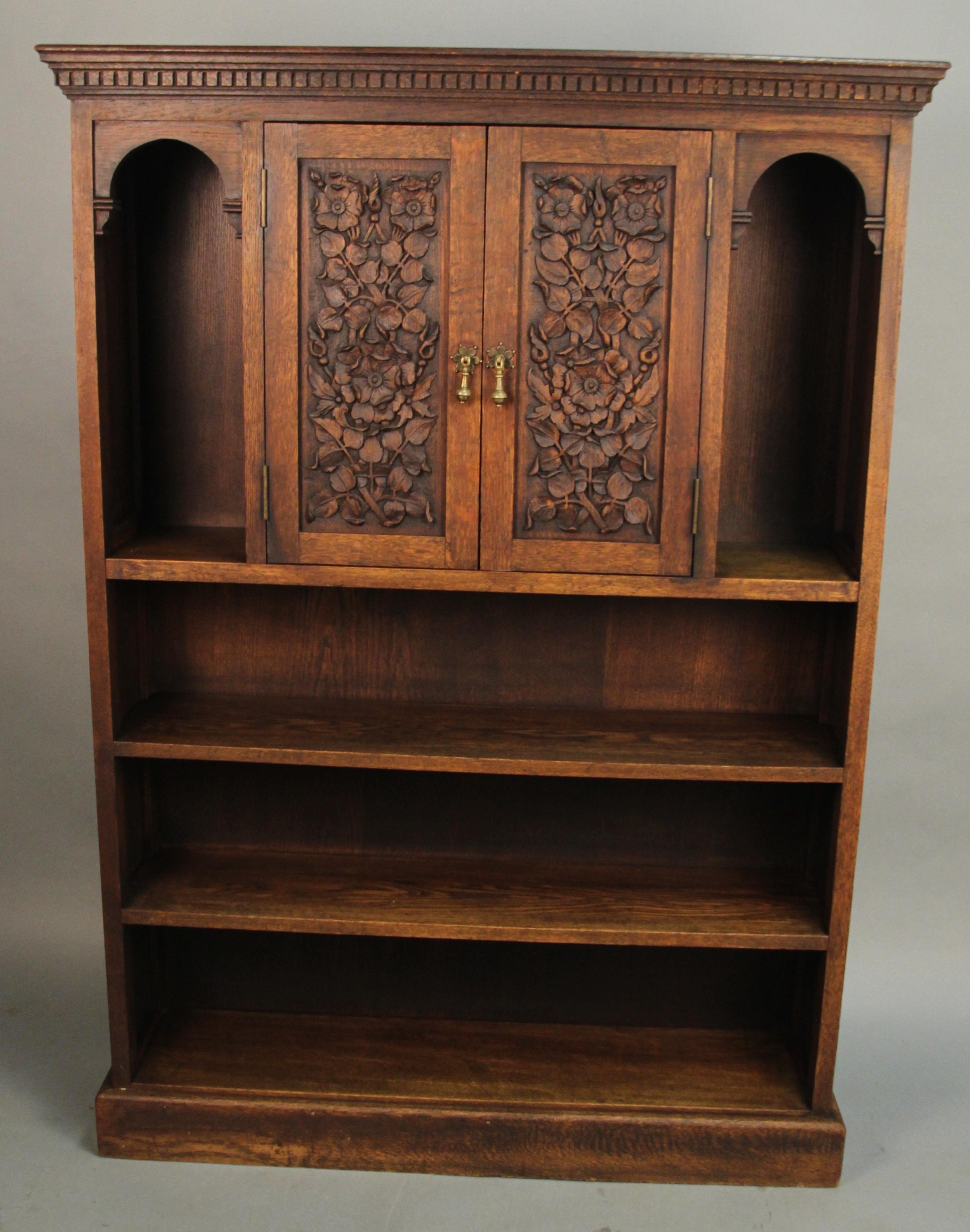 1920s bookcase with beautiful floral motif carved panels.