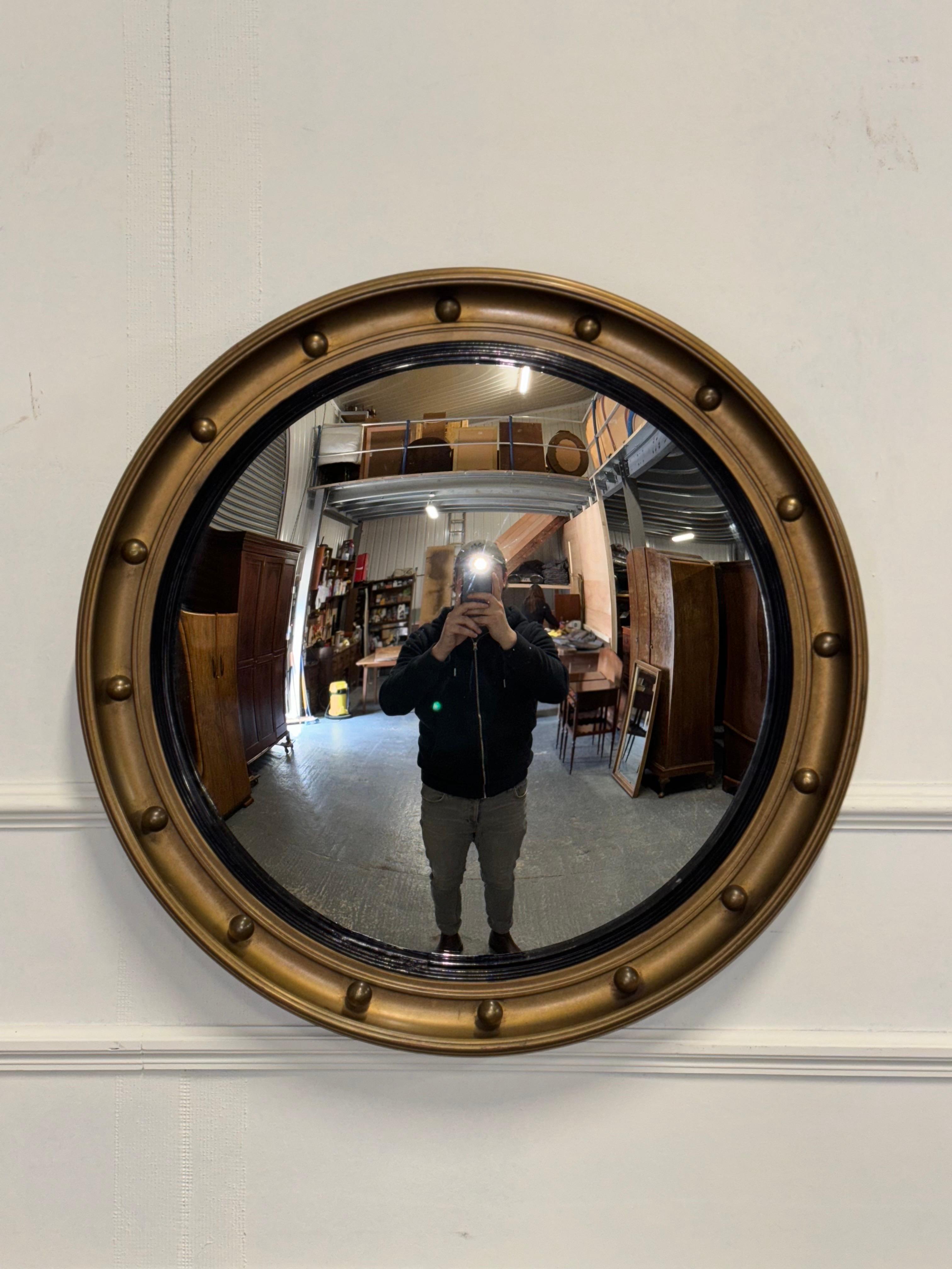 

We are delighted to offer for sale this Antique Convex Mirror With A Gold Frame.

 A luxurious and captivating piece that exudes elegance and grandeur. The convex shape of the mirror creates a unique visual effect, distorting reflections and