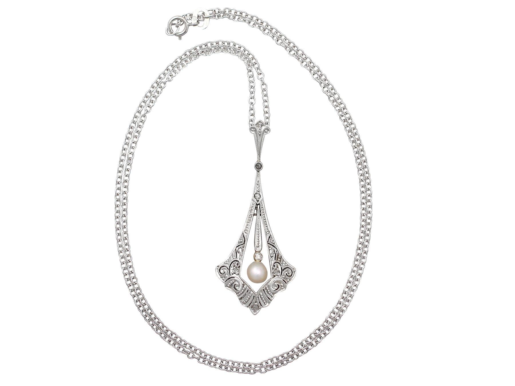 A fine and impressive antique 0.10 carat diamond and pearl 14 karat yellow gold, platinum set pendant; part of our diverse antique diamond jewelry and estate jewelry collections.

This impressive diamond and pearl pendant has been crafted in 14k