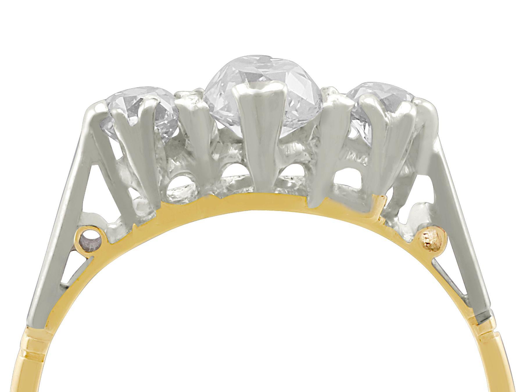 A fine and impressive antique 0.88 carat diamond and 18 karat yellow gold, platinum set trilogy ring; part of our diverse diamond jewelry and estate jewelry collections

This impressive antique diamond trilogy ring has been crafted in 18k yellow