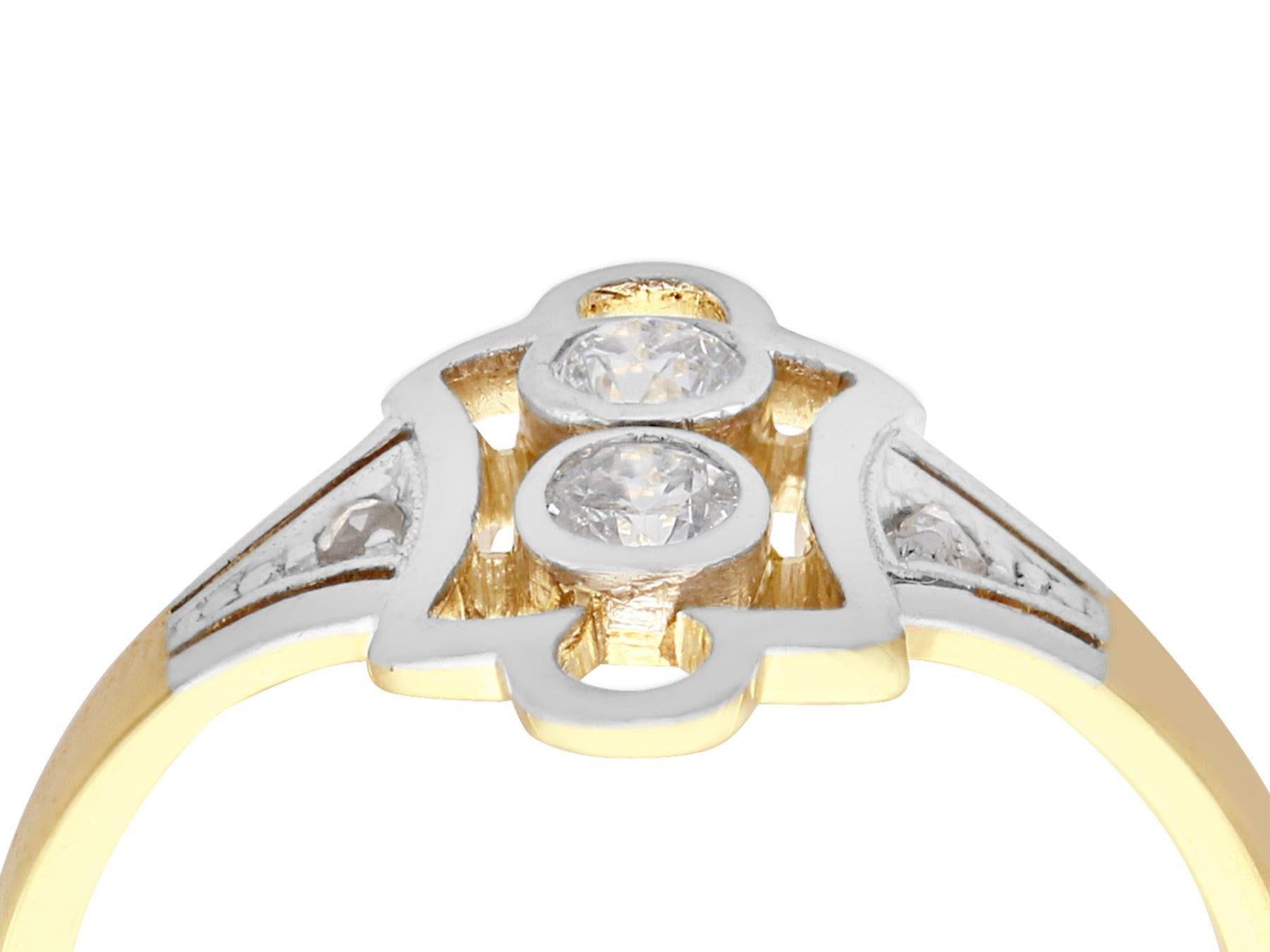 An impressive European 0.21 carat diamond and 14 karat yellow gold, 14 karat white gold set cocktail ring; part of our diverse antique jewelry and estate jewelry collections.

This fine and impressive European diamond ring has been crafted in 14k